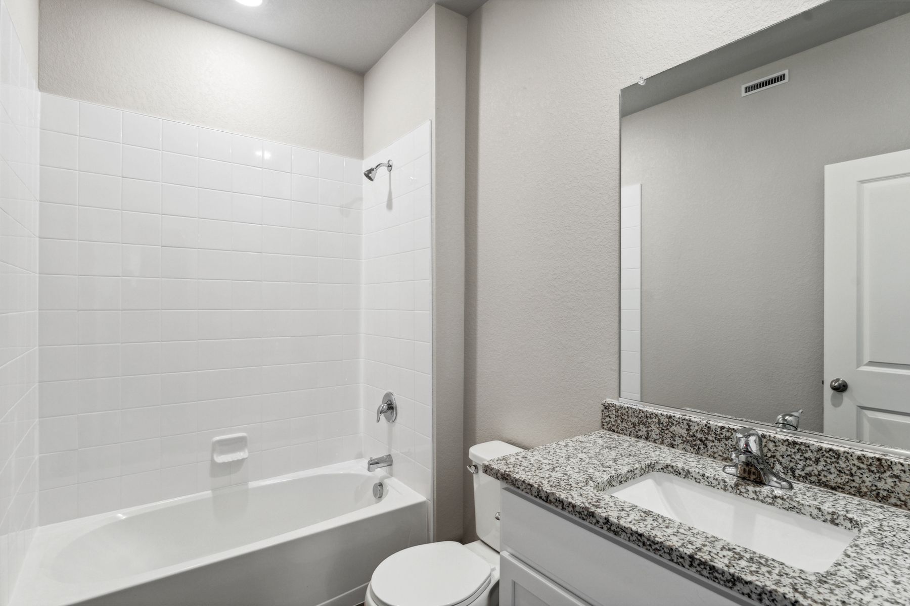 The secondary bathroom has a tub/shower combination.