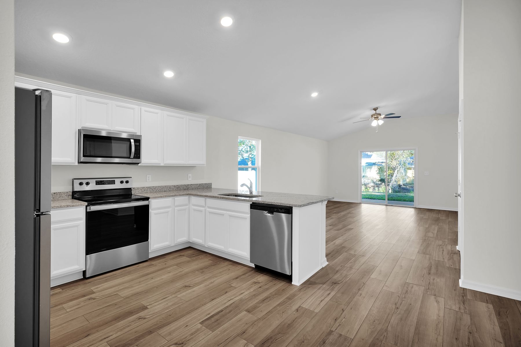 The kitchen overlooks the spacious living area.