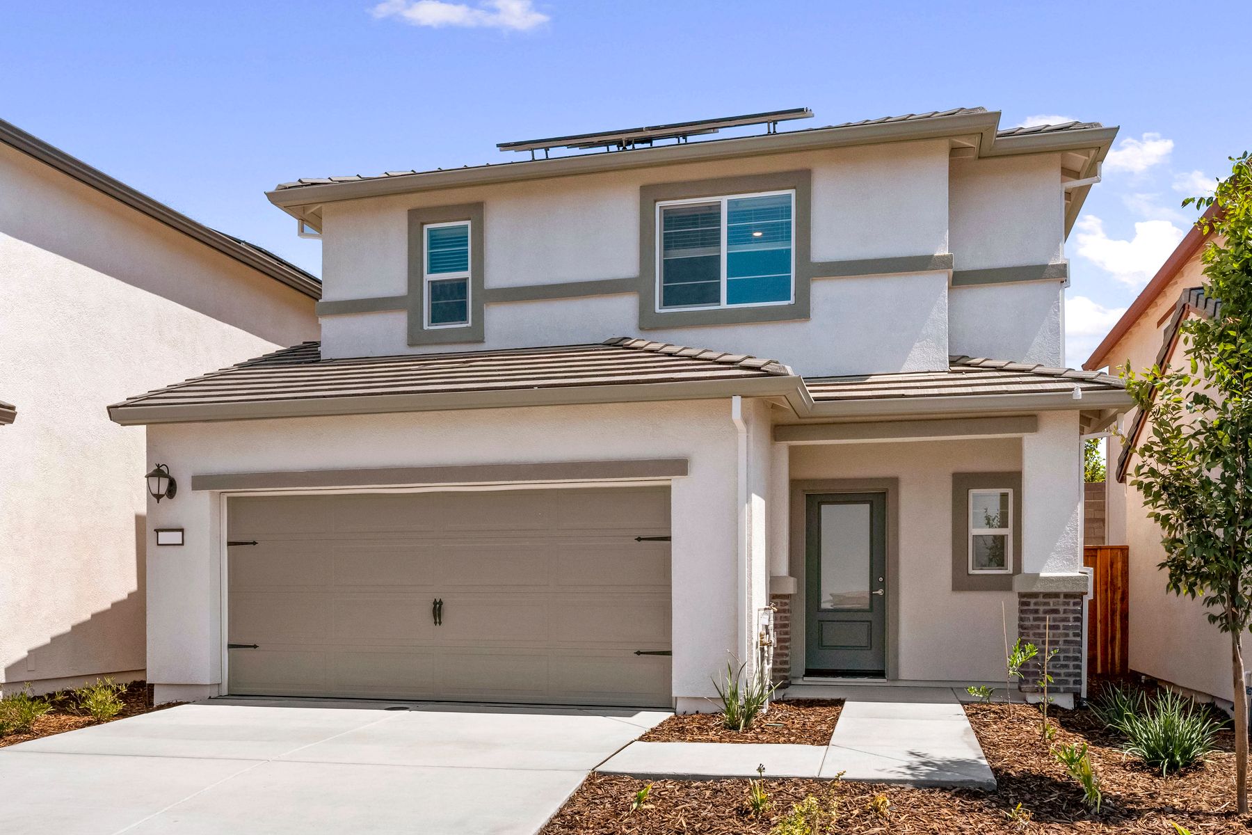 The Davidson is a beautiful home with stucco and stone.
