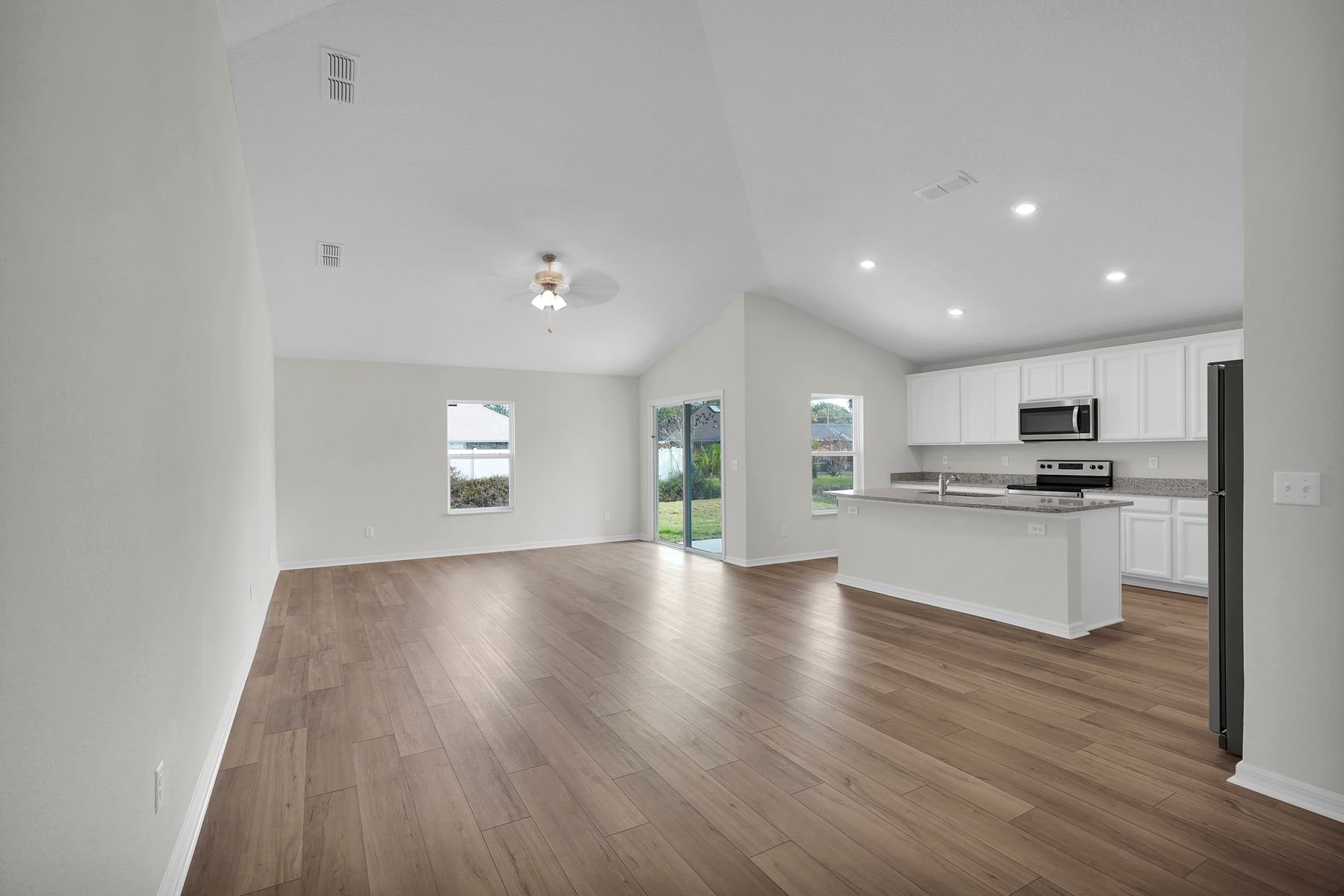 This open-concept floor plan allows you to move freely from the kitchen to the family room