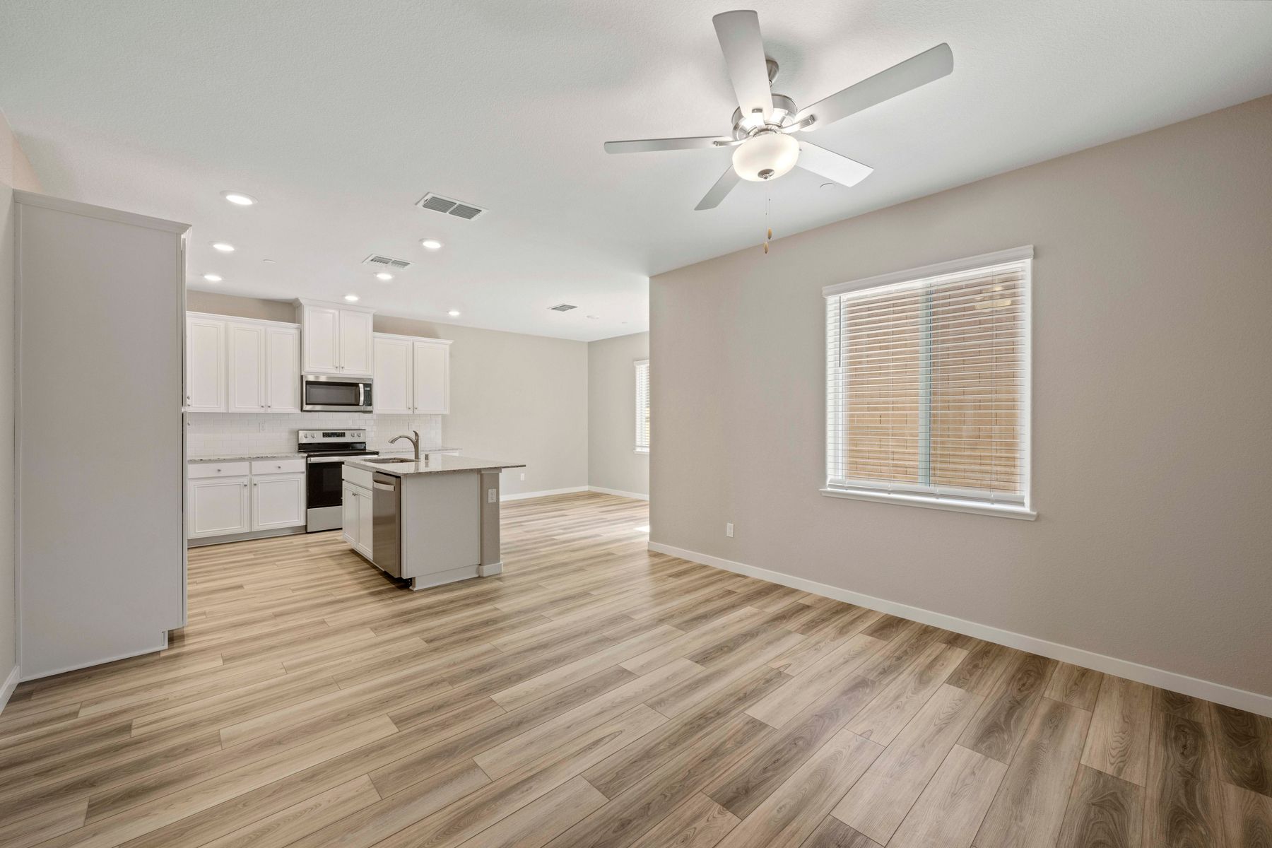 The Shelby has an open layout with the kitchen opening to the family room and dining room.