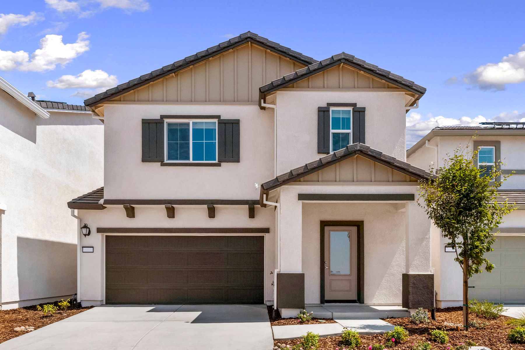 The Shelby is a beautiful home with stucco.,