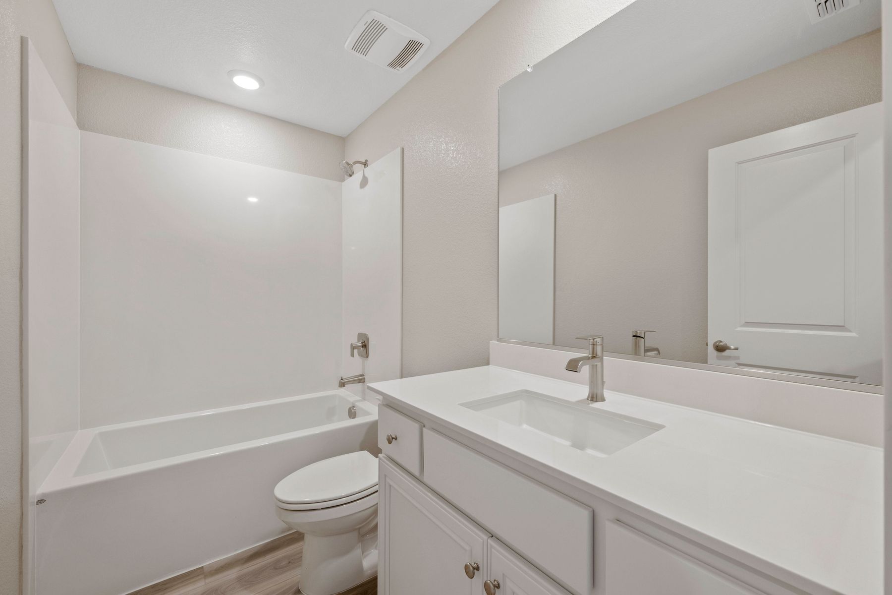 The secondary bathroom has a tub/shower combo.