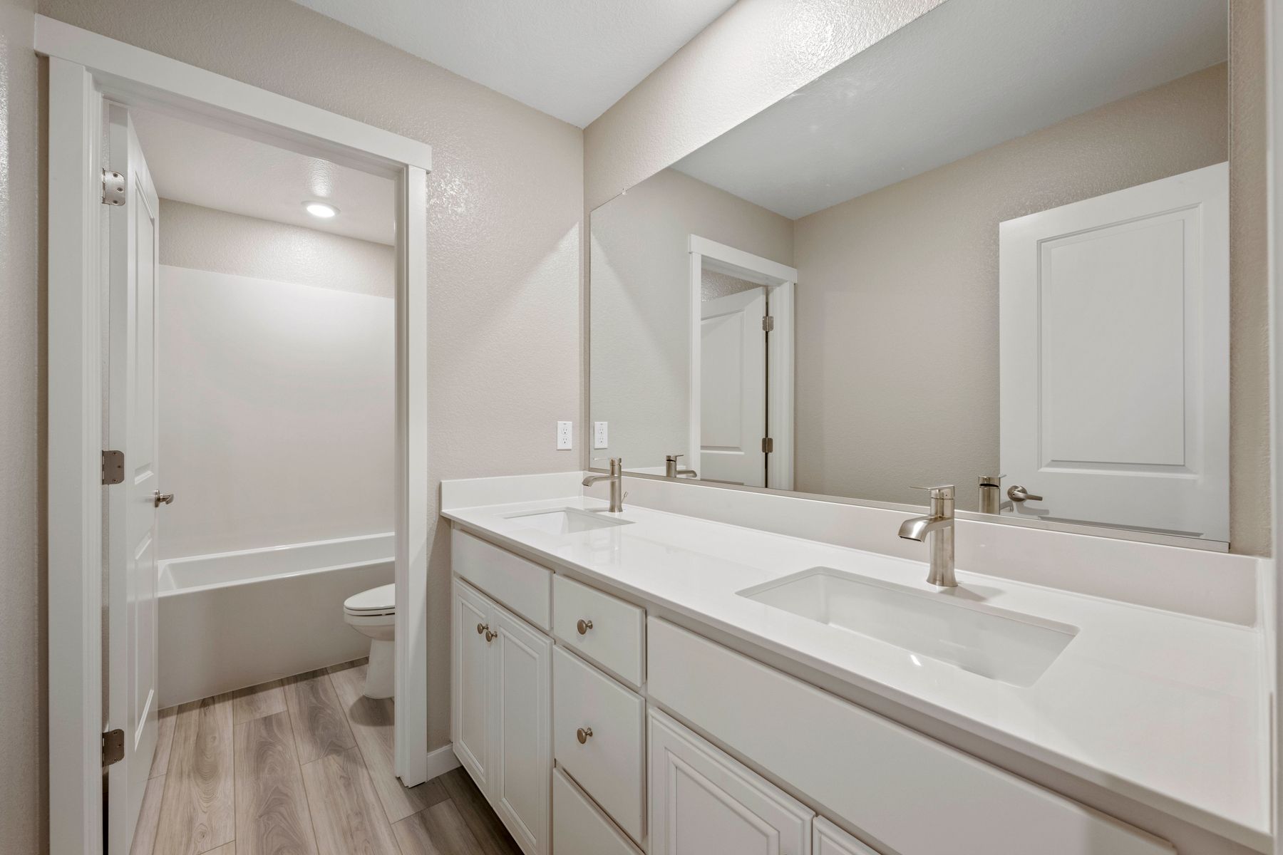 The secondary bathroom has a tub/shower combo.