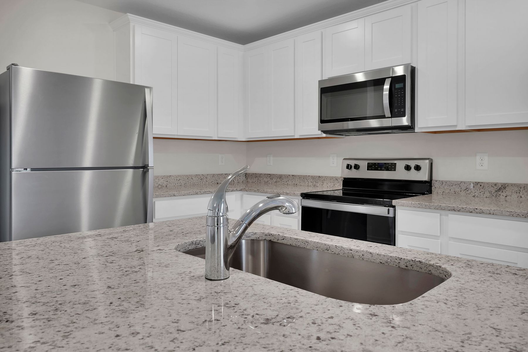 The kitchen comes with a full suite of stainless steel appliances!