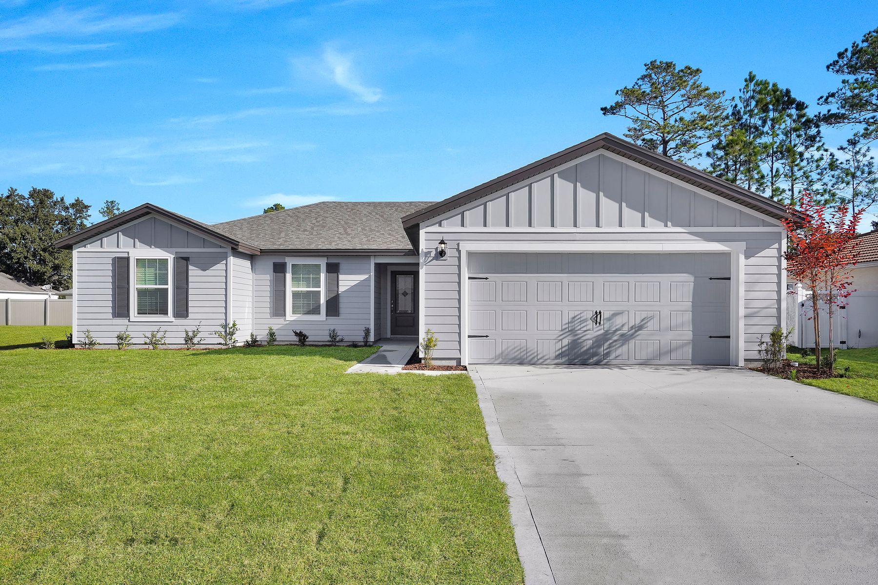 This home has a 2-car garage and professional landscaping.