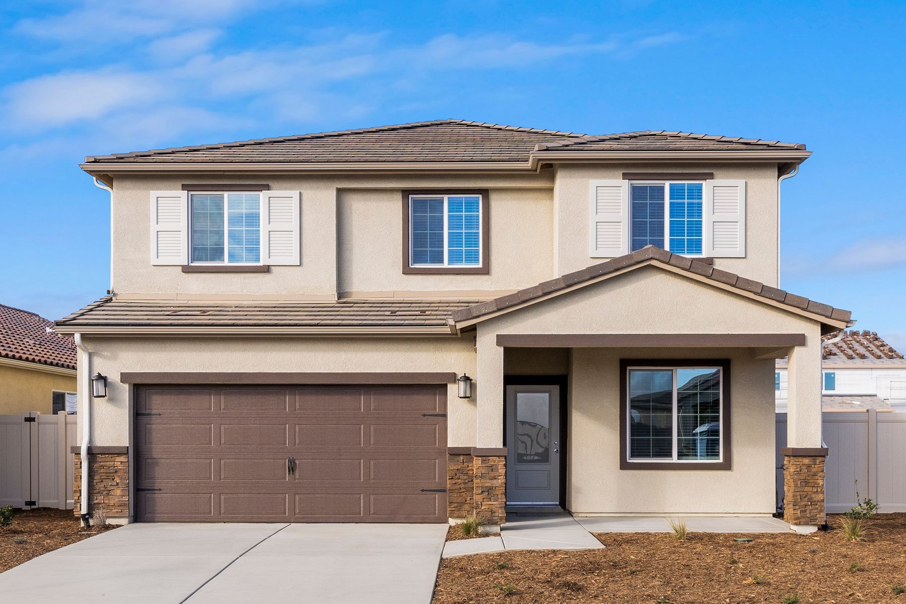 The Venice is a beautiful two story home with stucco.
