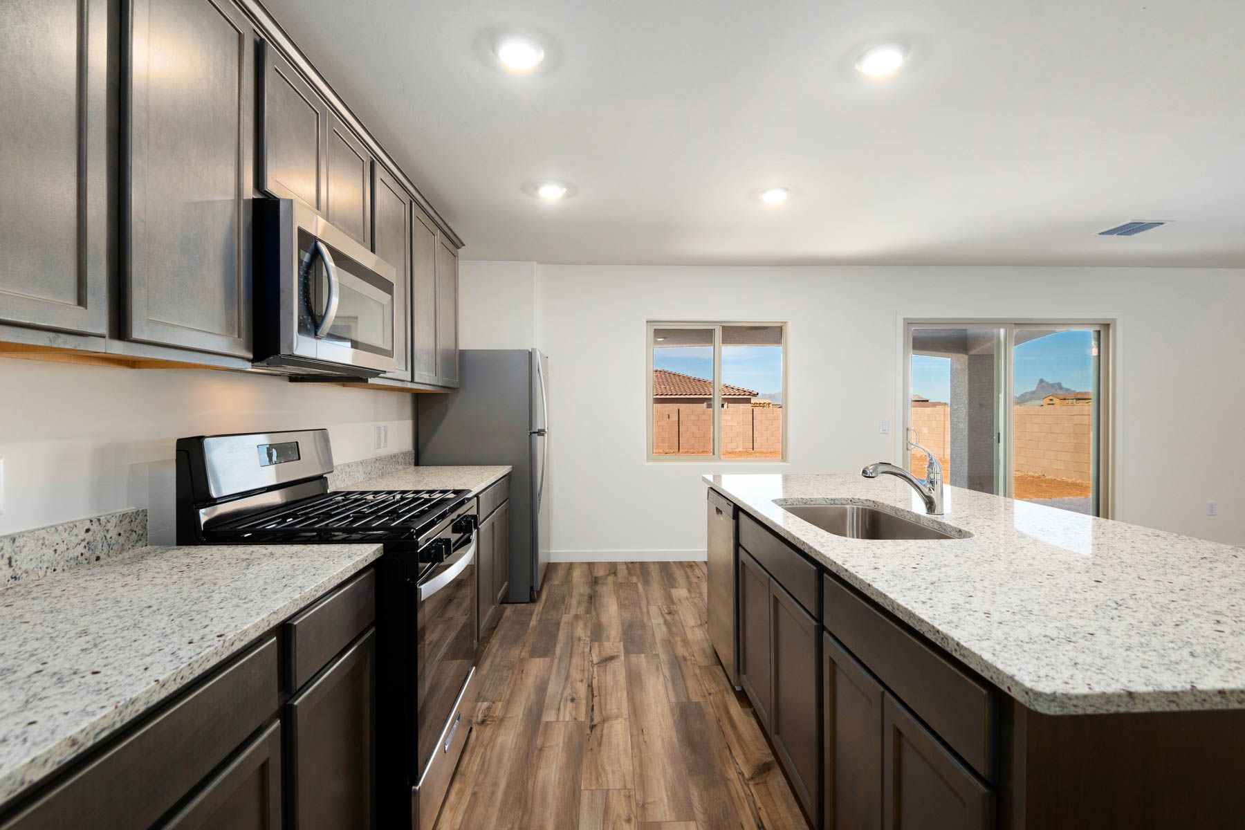 The kitchen opens up to the back patio. 