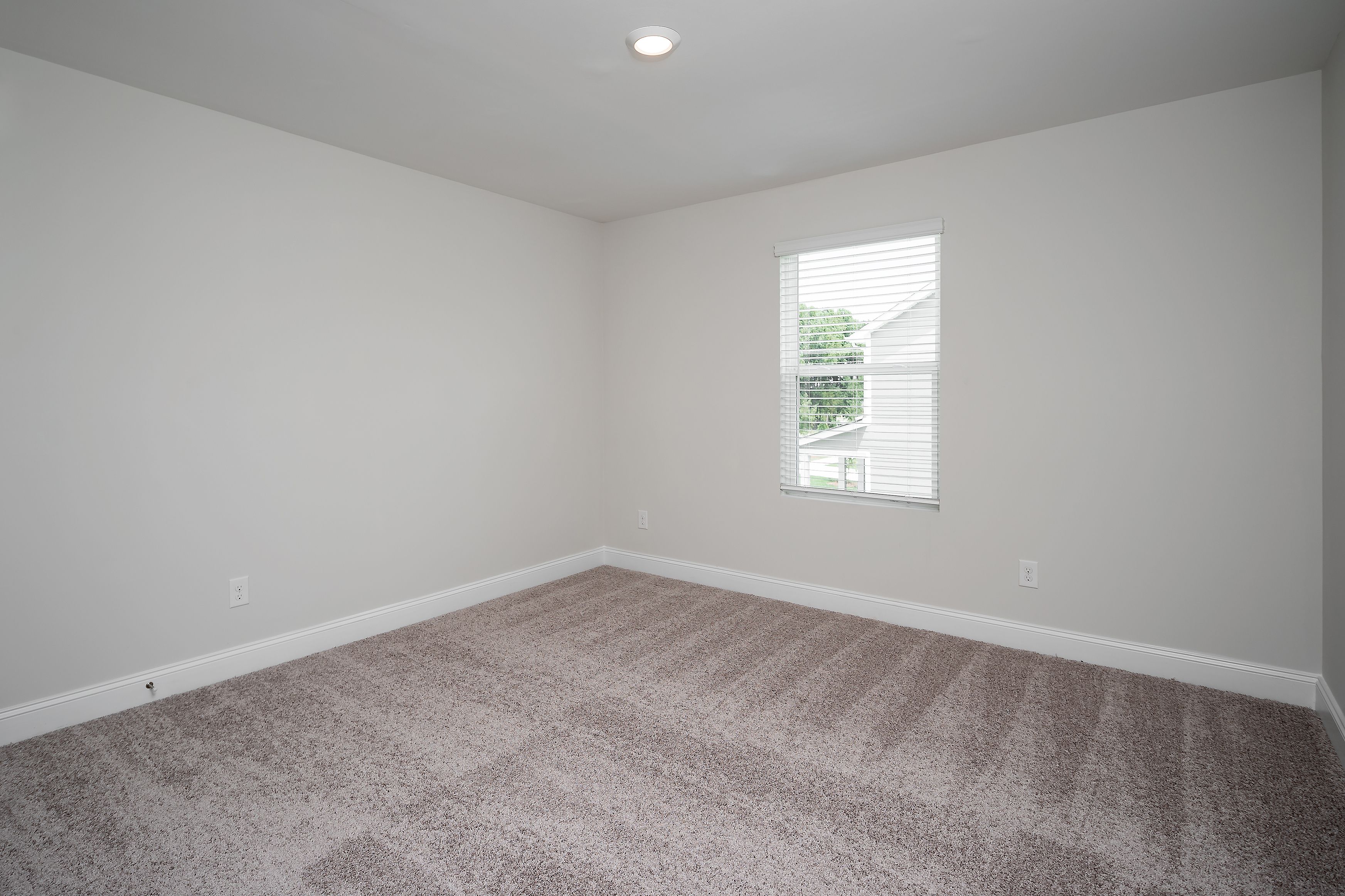 This bedroom has plenty of space for your king-sized furniture!