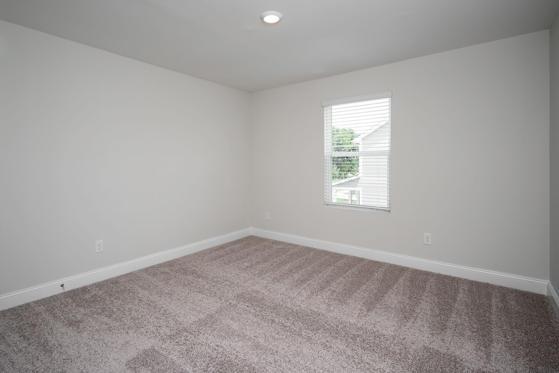 This bedroom has plenty of space for your king-sized furniture!