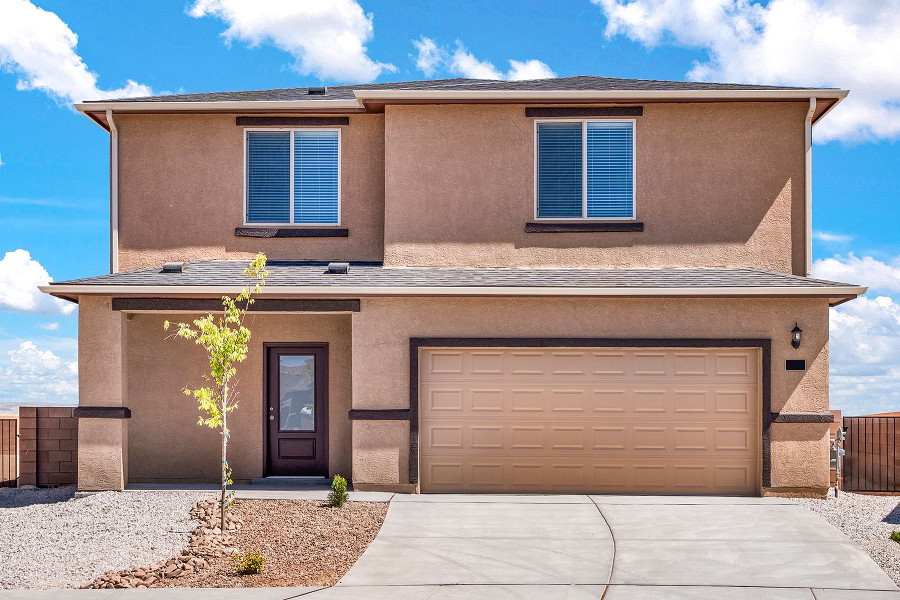 This home has a spacious two-car garage and stucco exterior.