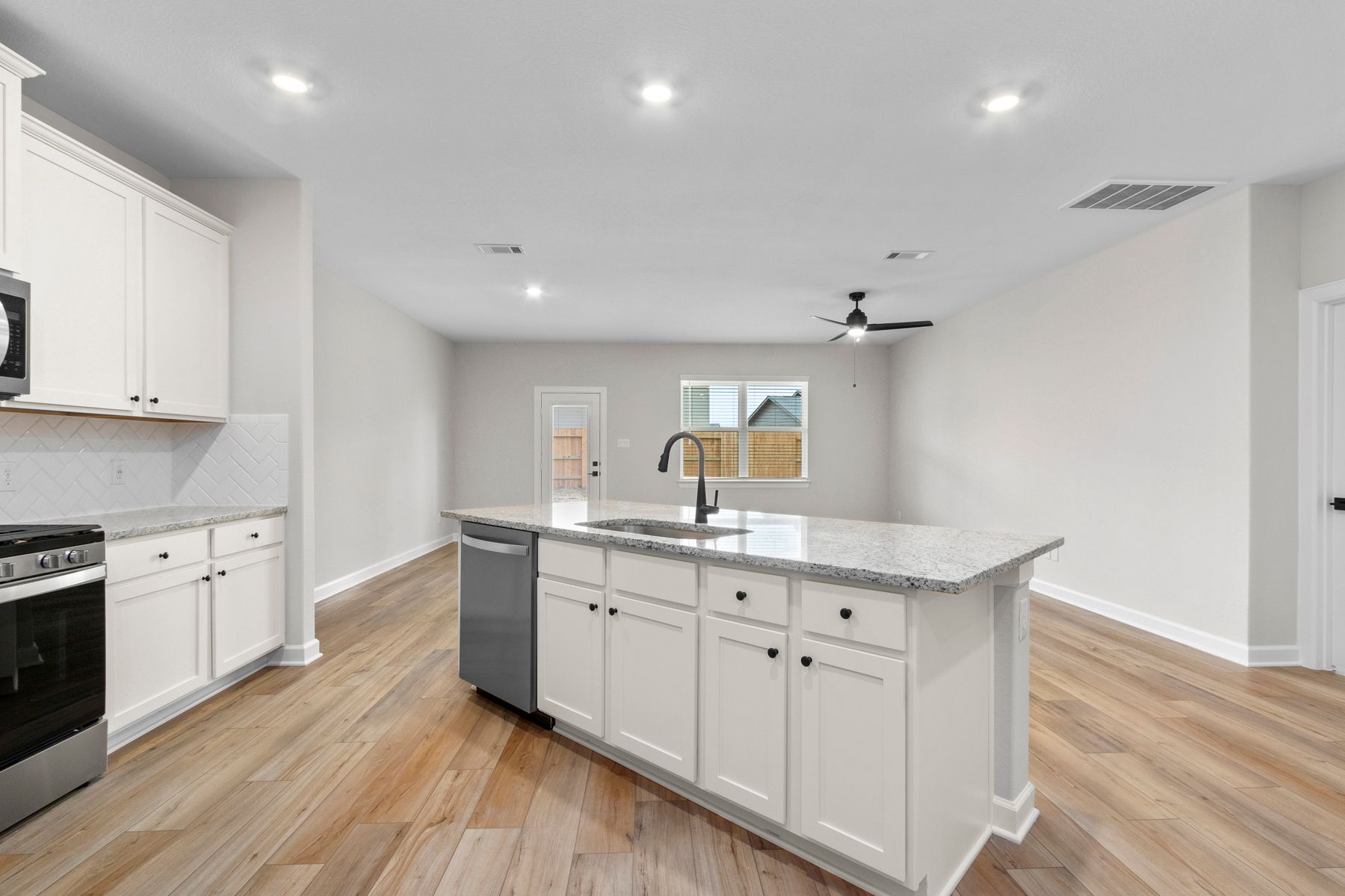 Both the kitchen and dining room overlook the spacious backyard.