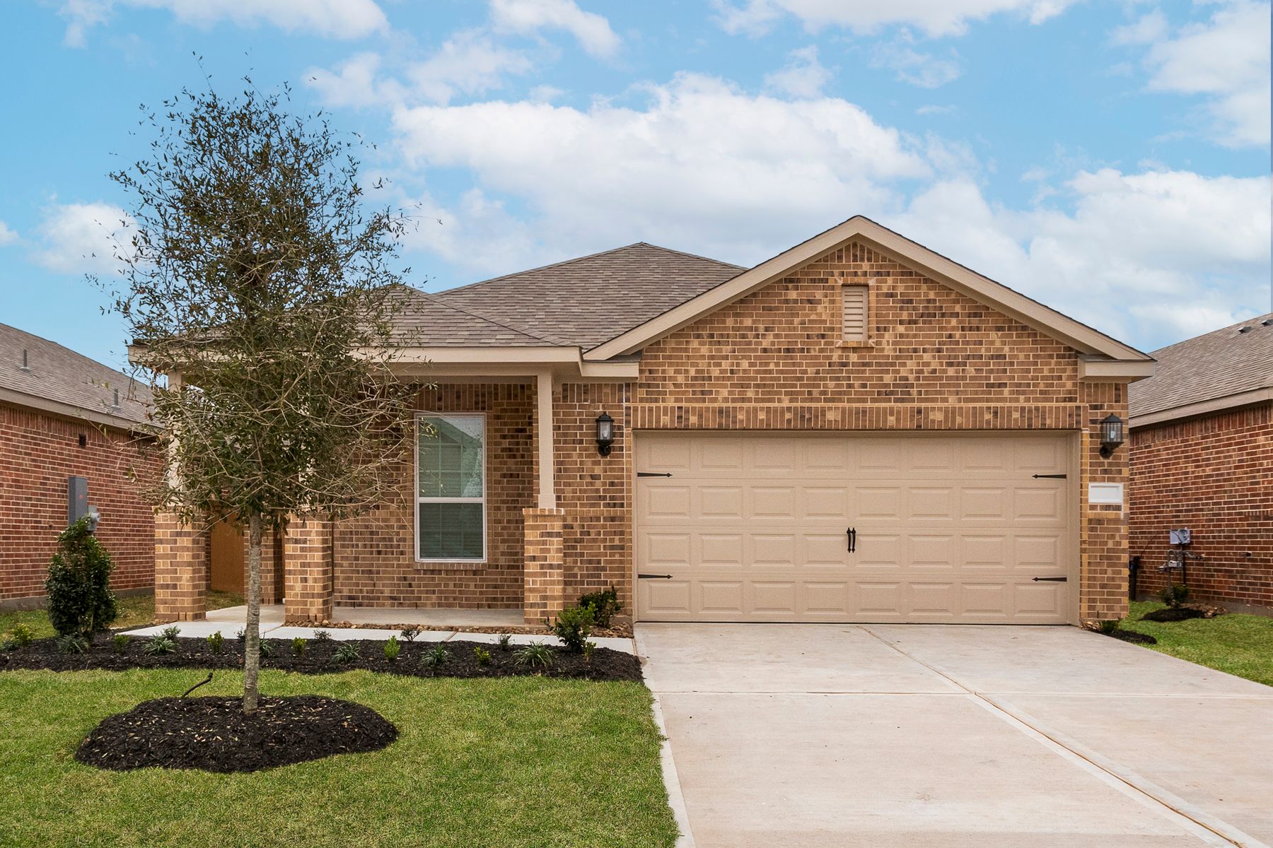 This home has a 2-car garage and gorgeous stone detailing.