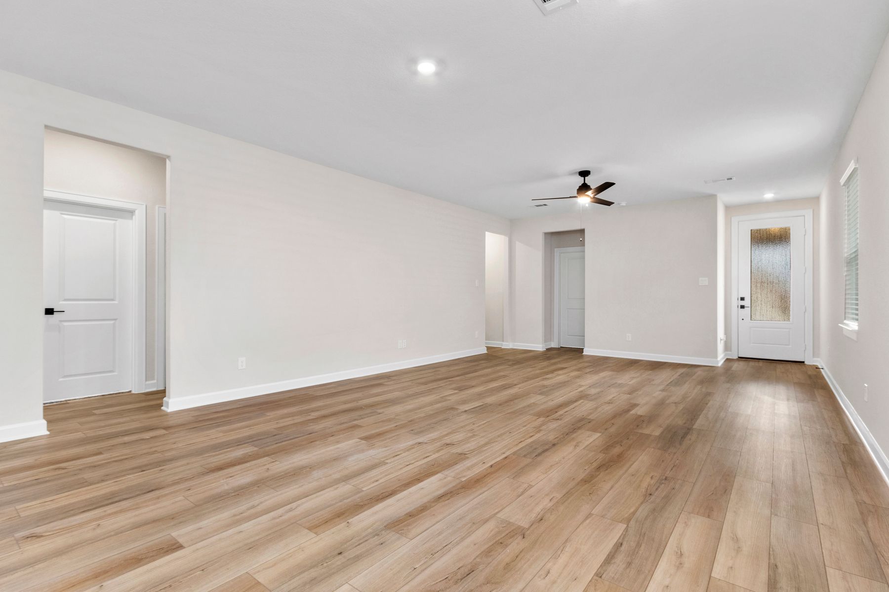 The entryway is highlighted by this gorgeous 3/4 lite door!