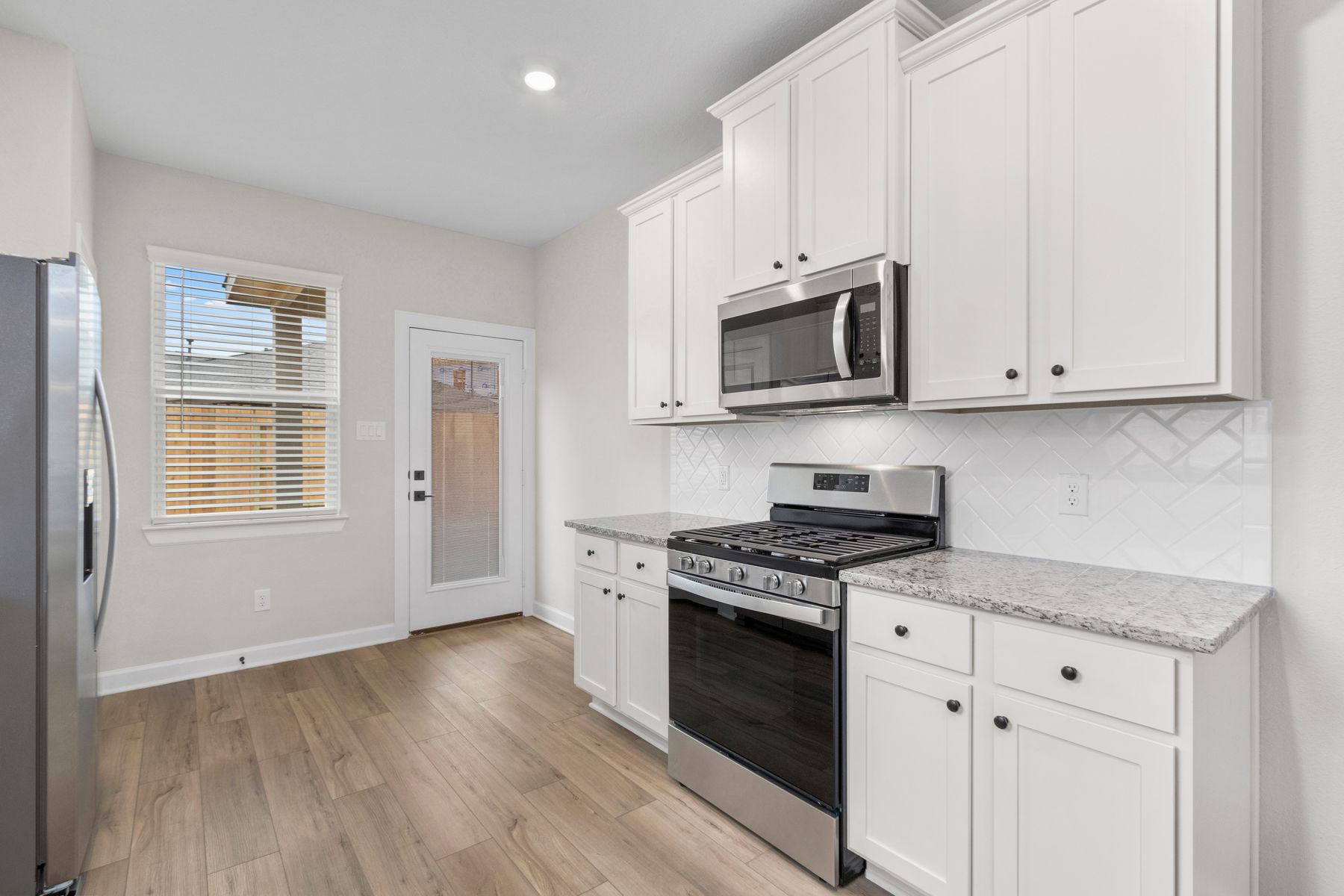 The kitchen comes with a full suite of energy-efficient appliances.