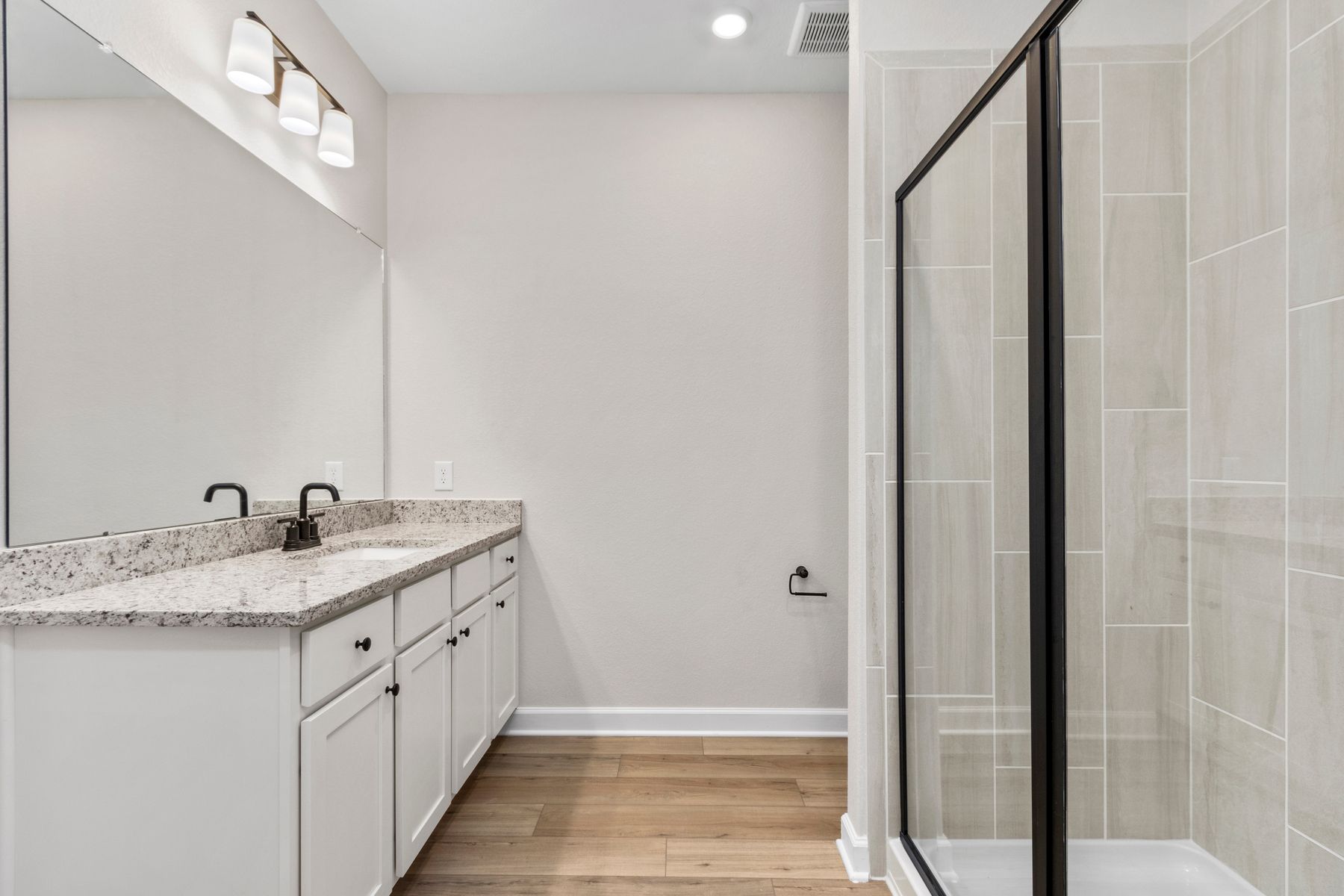The master bath has a private commode and tons of drawer space.
