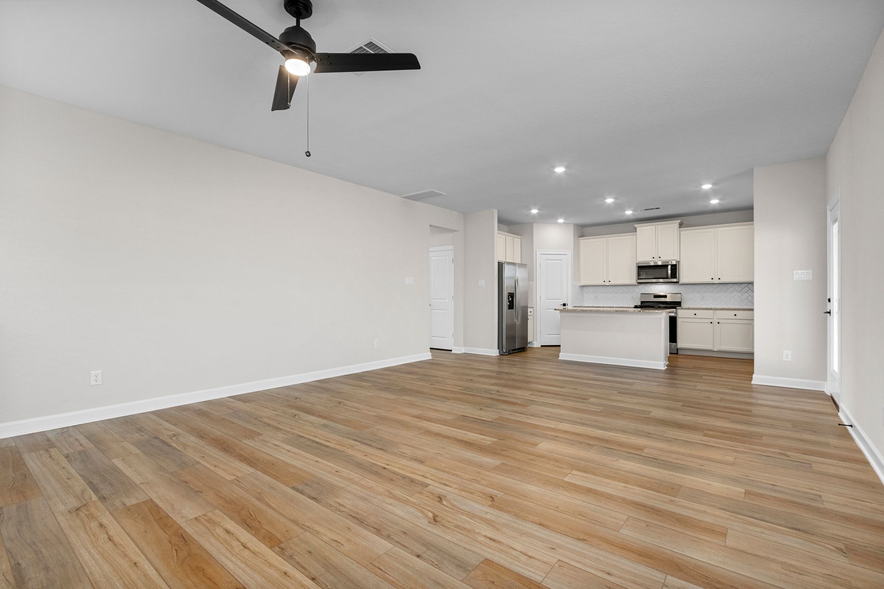 The dining room is open to the kitchen and family room.