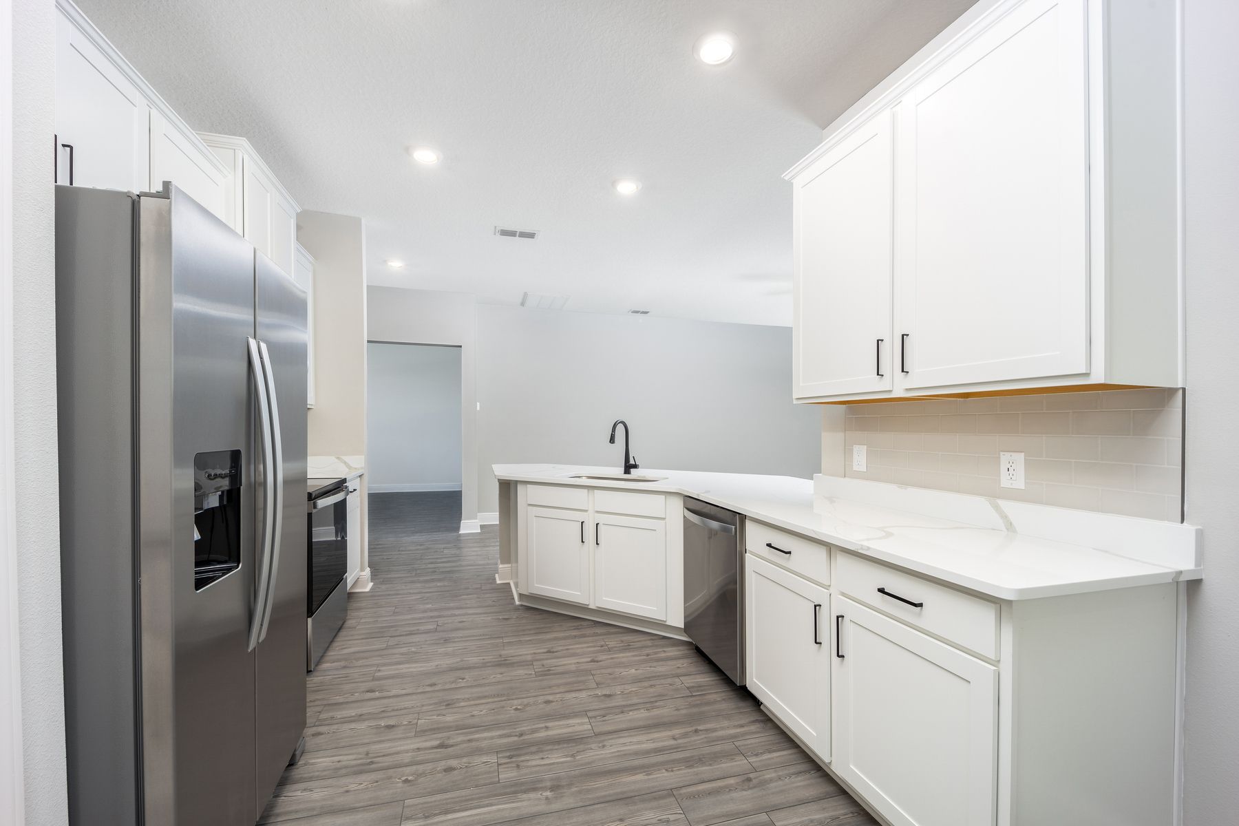 Enjoy beautiful quartz countertops and wood cabinetry!