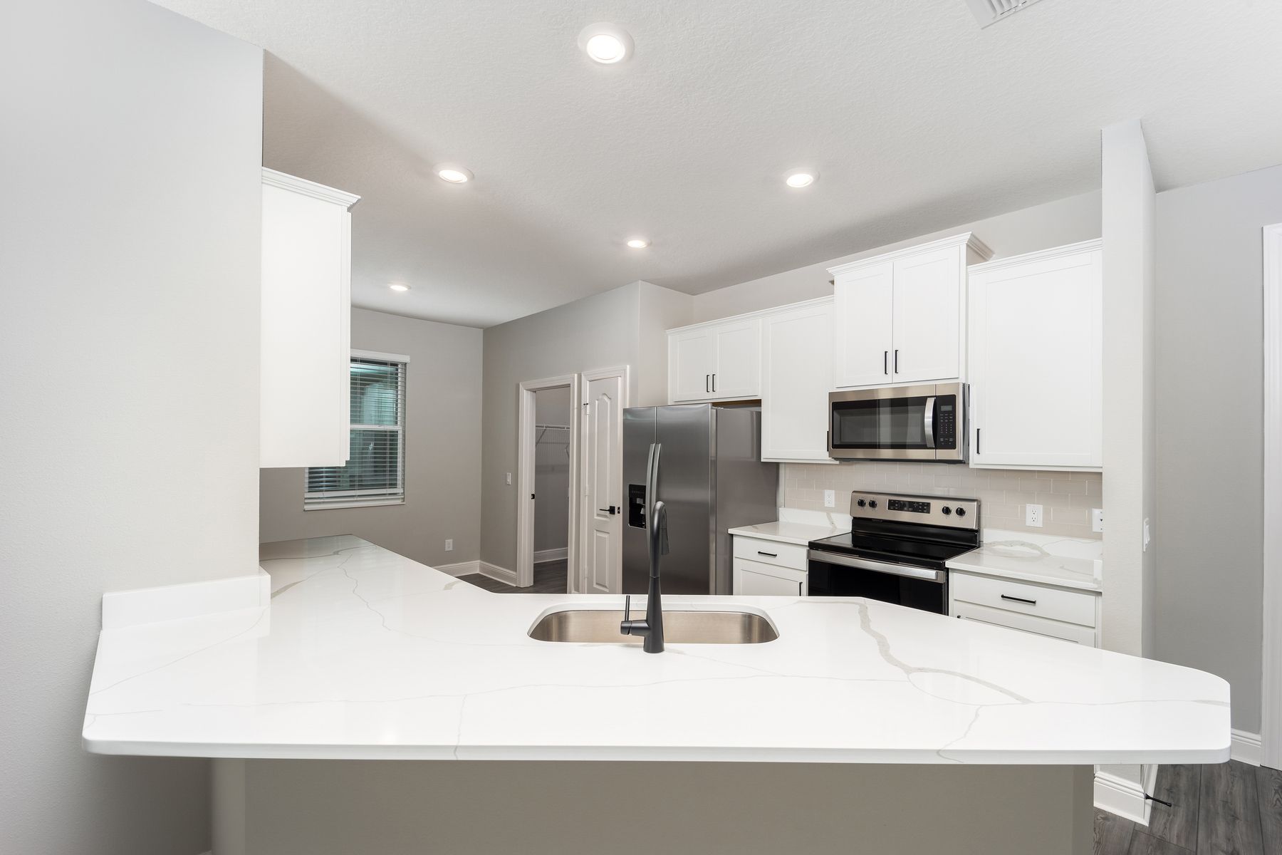 This kitchen includes a full suite of stainless steel appliances!