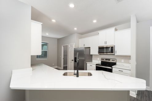 This kitchen includes a full suite of stainless steel appliances!