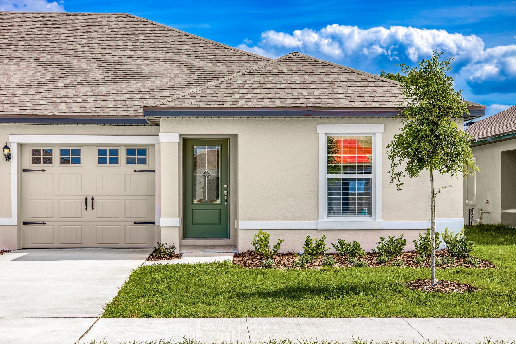 Beautiful stucco exterior with professional landscaping. 