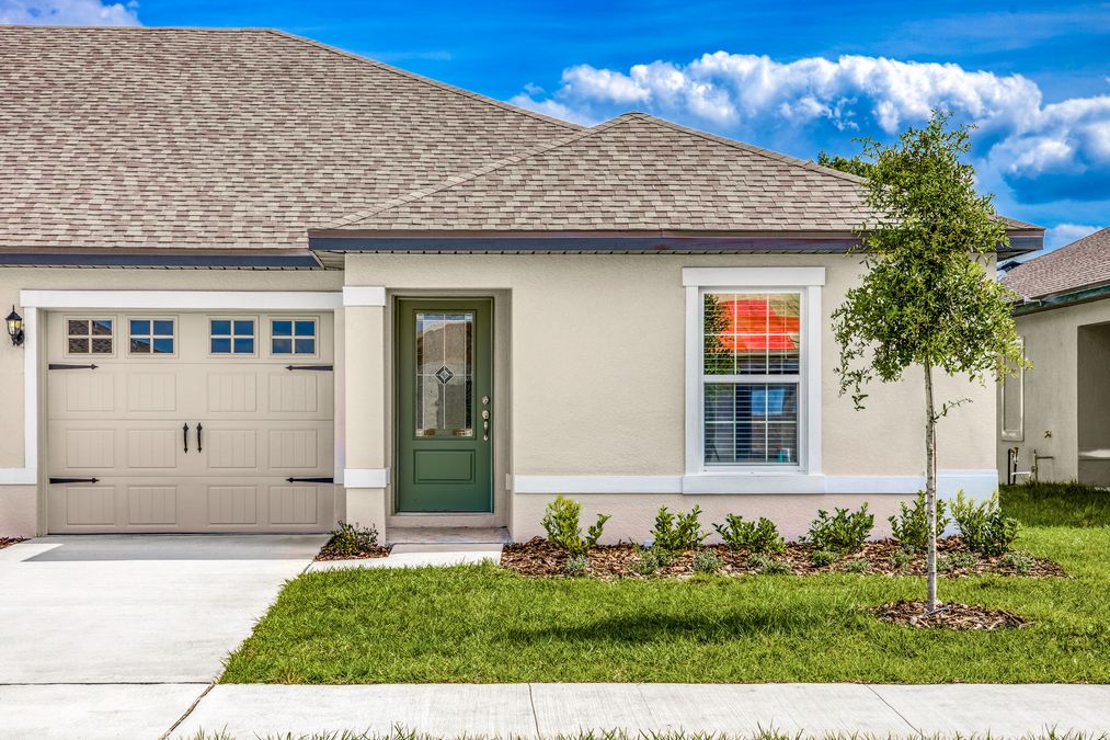 Beautiful stucco exterior with professional landscaping.