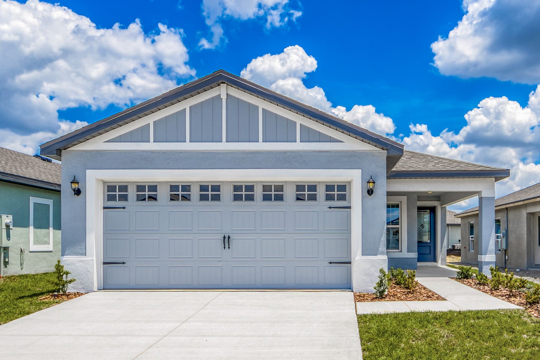 Beautiful stucco sexterior with professional landscaping.