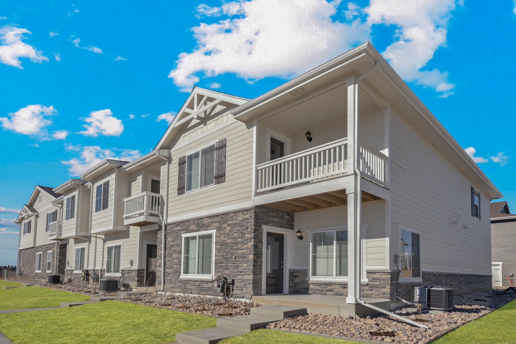 The Monarch is a beautiful two story home with siding and stone.