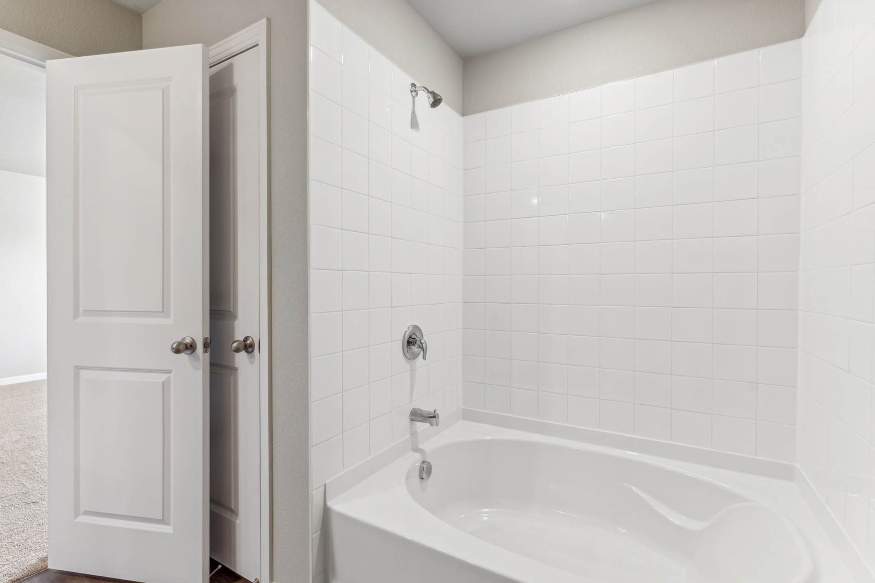 The master bathroom has a tub/shower combo.