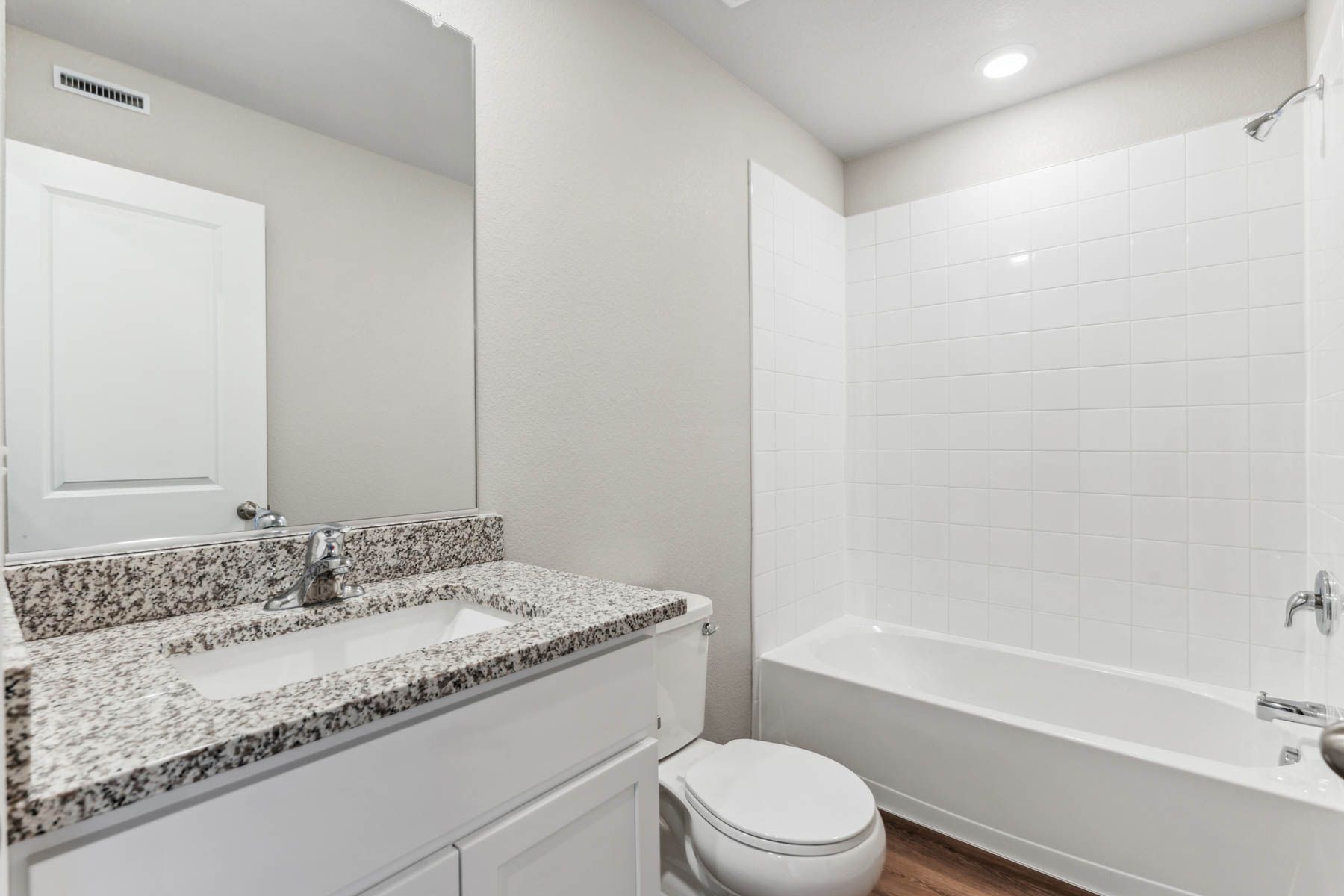 The secondary bathroom has a tub/shower combo.