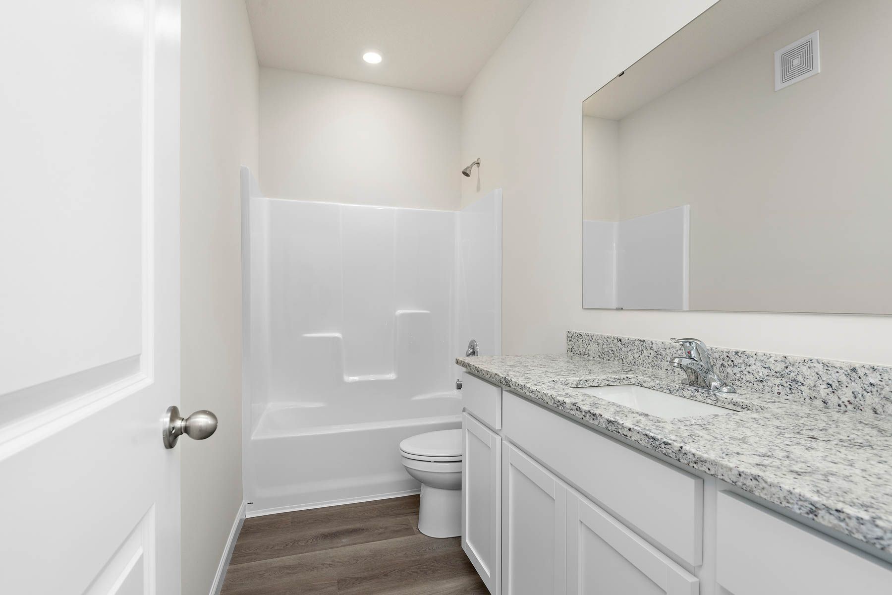 The secondary bathroom has a tub/shower combo.