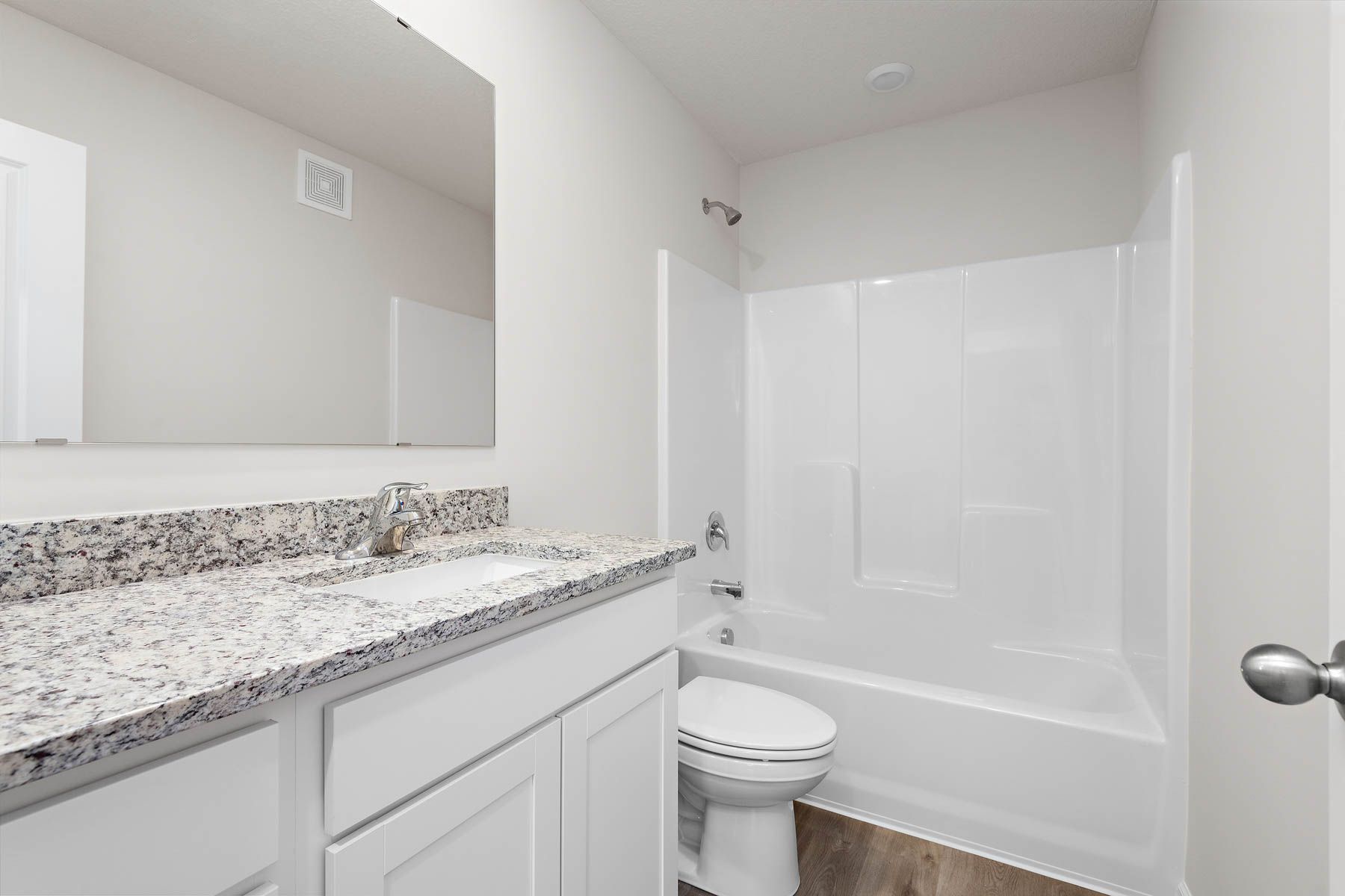 The secondary bathroom has a tub/shower combo.