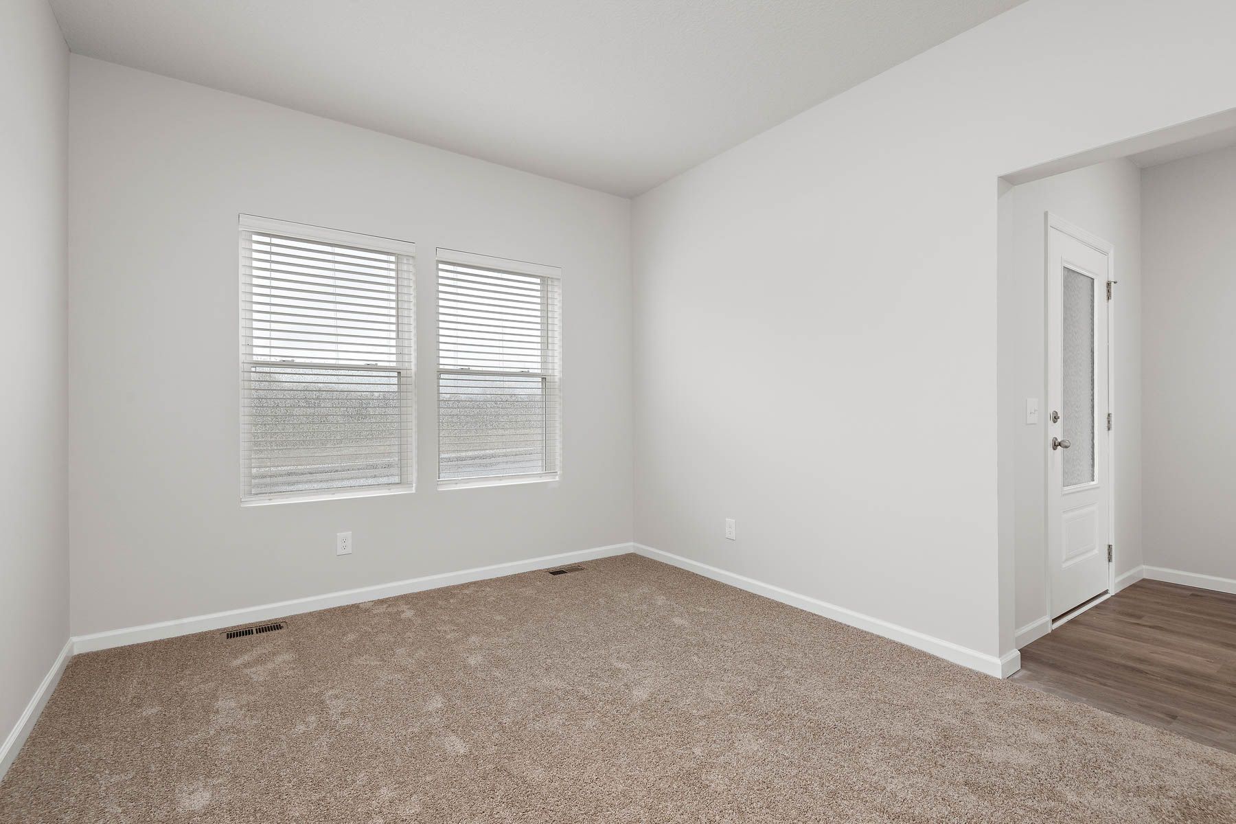 There is a flex room off the foyer.