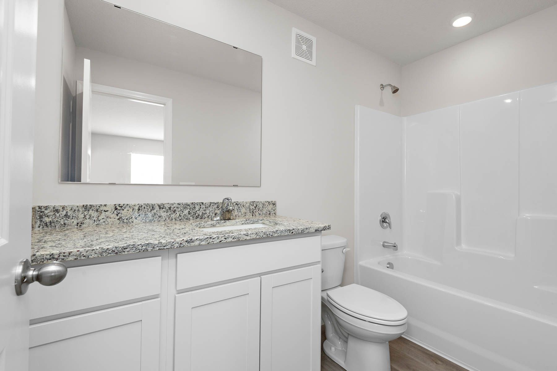 The secondary bathroom has a tub/shower combo.
