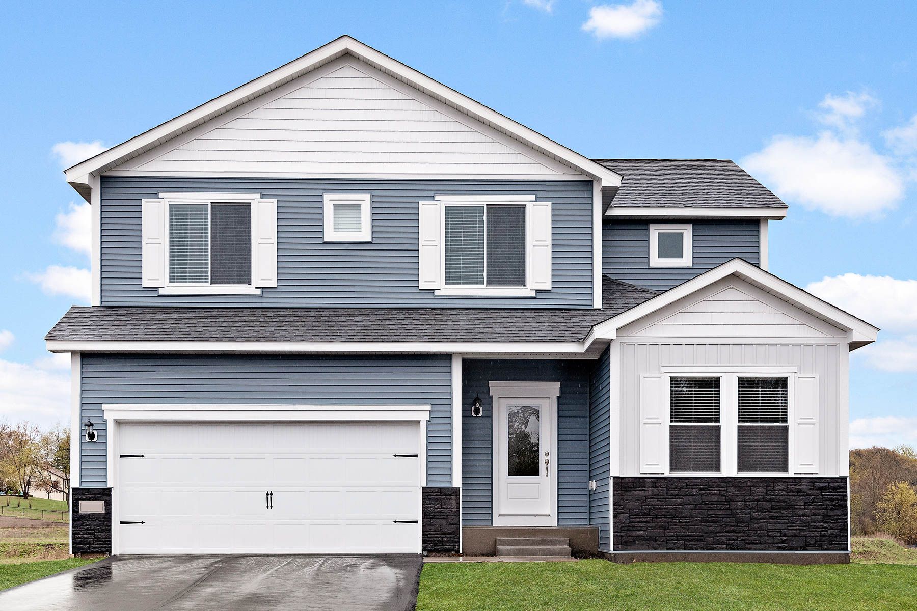 The Henry is a beautiful two story home with siding.