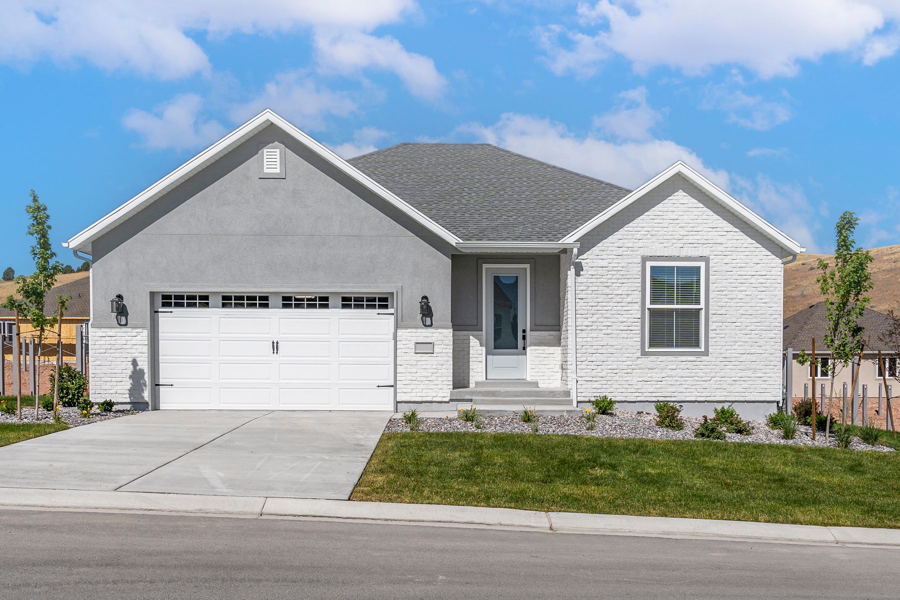 The Antelope is a beautiful single-story home with stucco and stone.