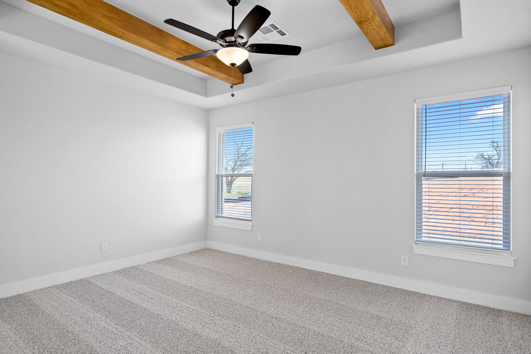The master bedroom is spacious and the perfect place to relax.