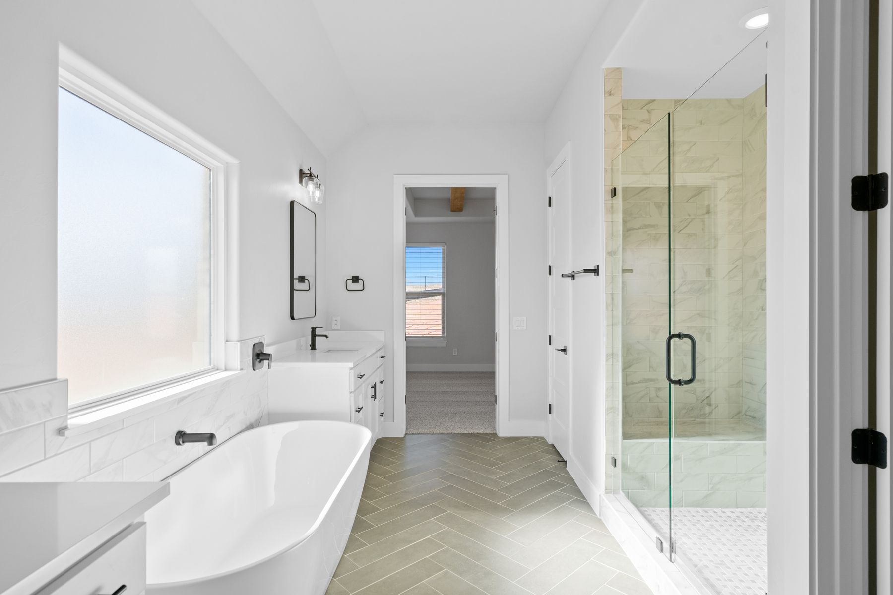 The master bathroom hosts walk-in shower!