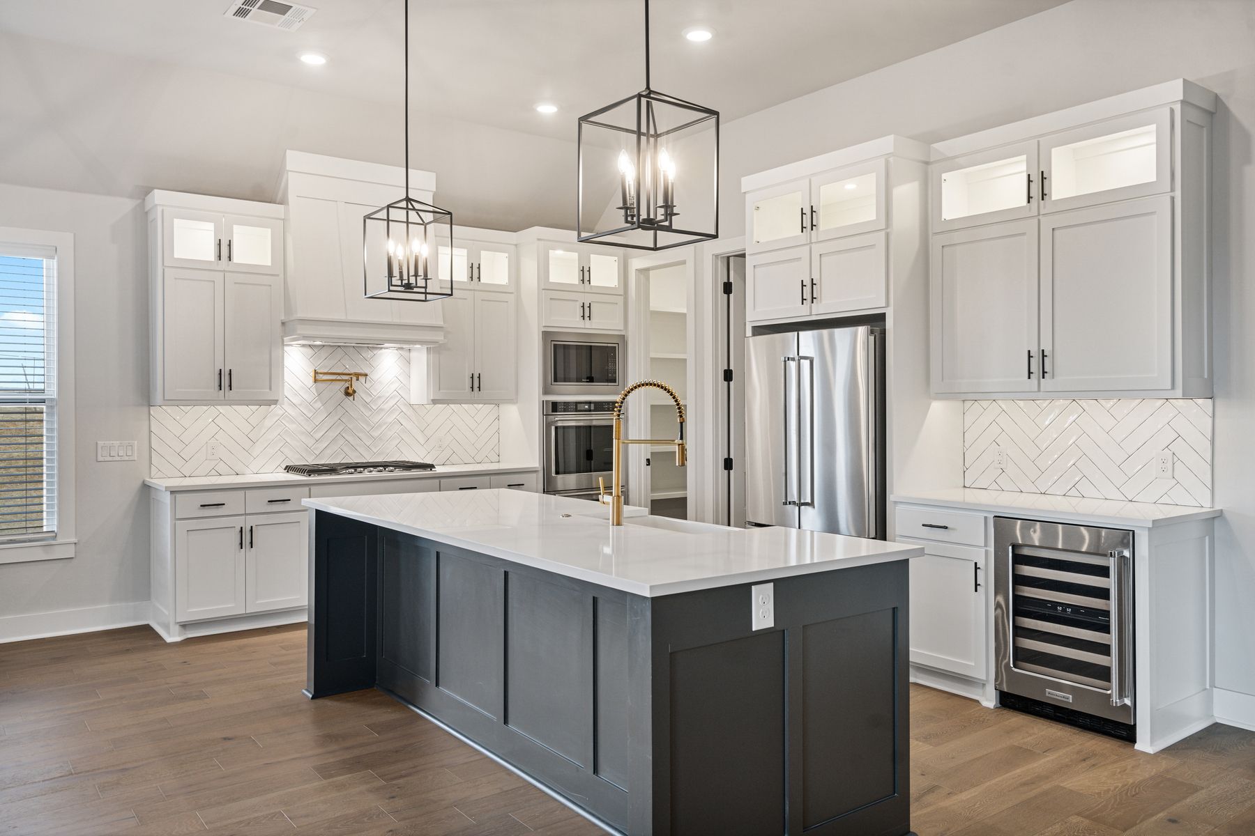 The kitchen is the centerpiece of the home and is sure to impress.