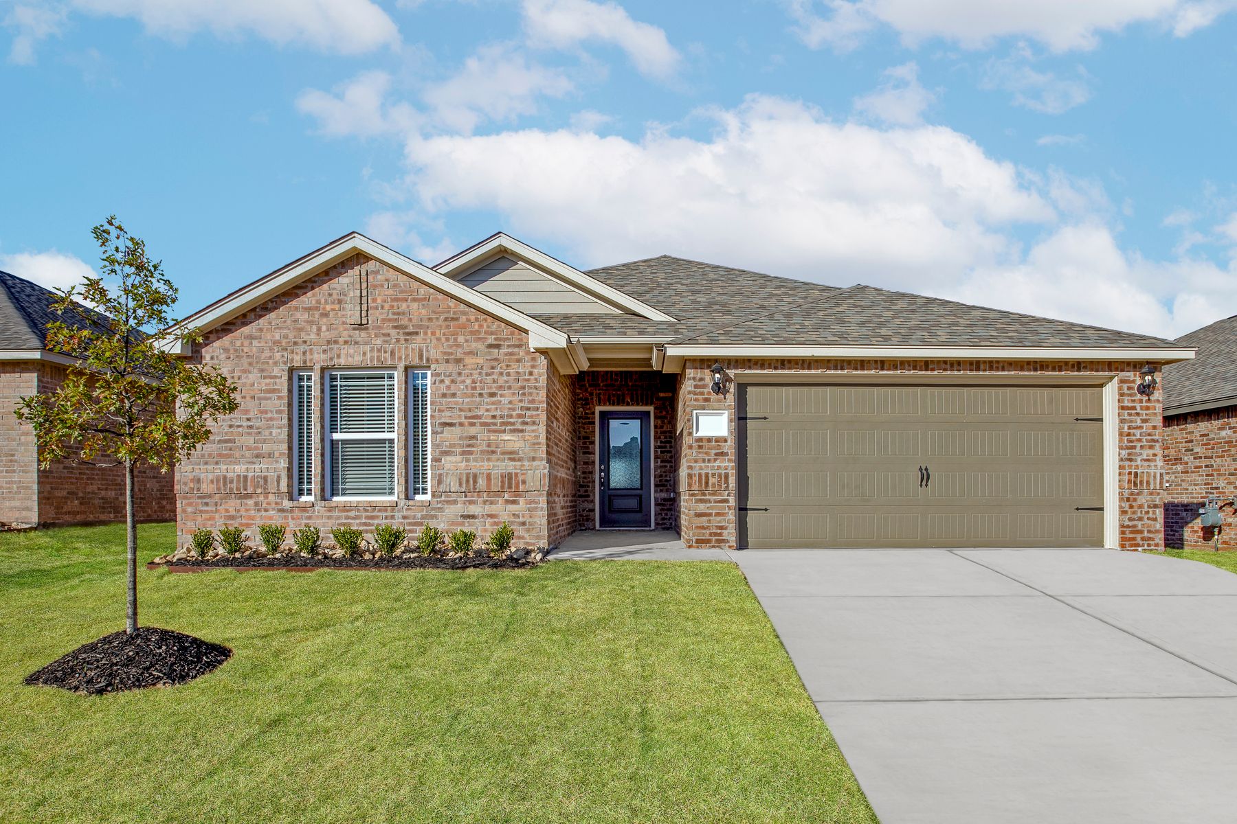 The Keystone is a beautiful, one-story home with a brick exterior.