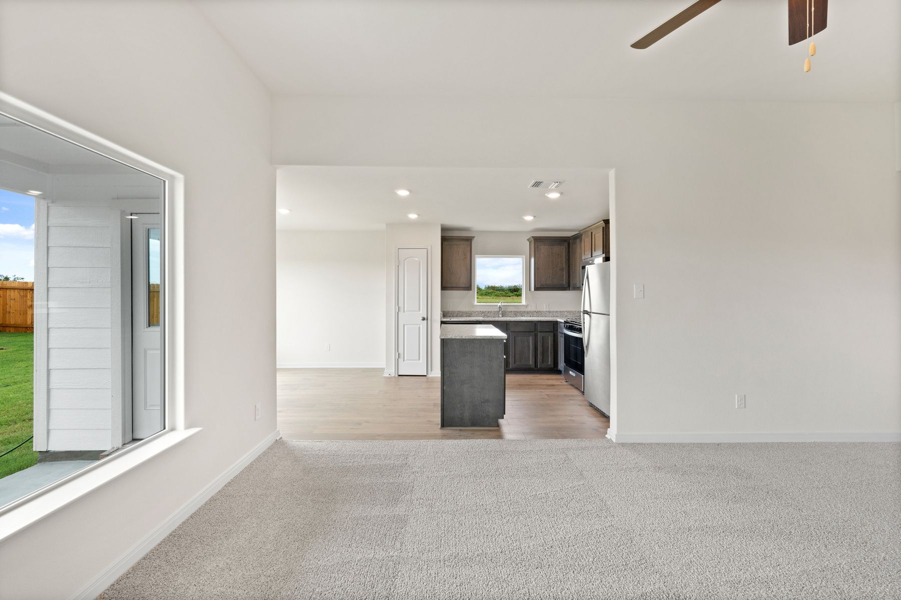 The open layout connects the family room with the kitchen and dining room.