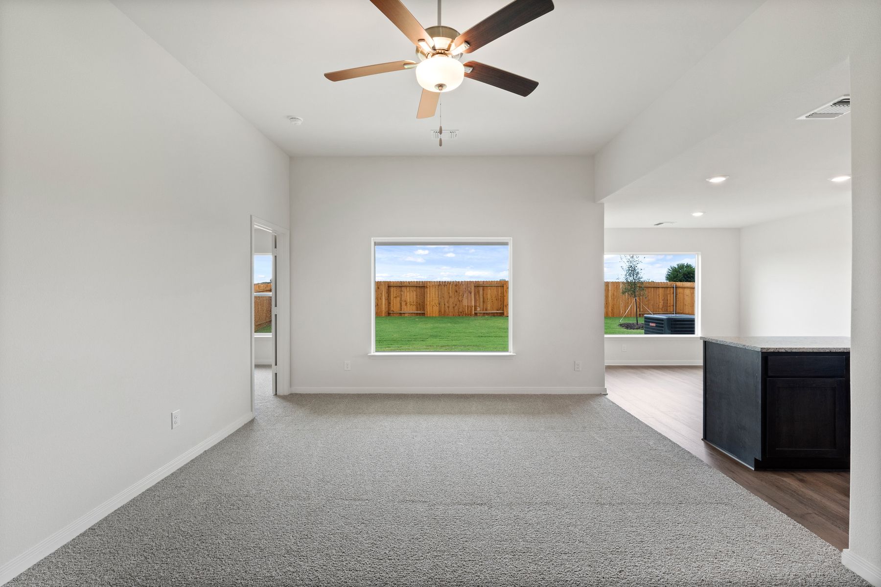 The open layout connects the family room with the kitchen and dining room.