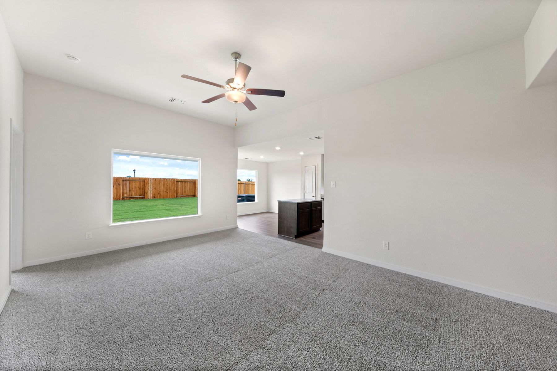 The large windows in the family room let in great, natural light and backyard views.