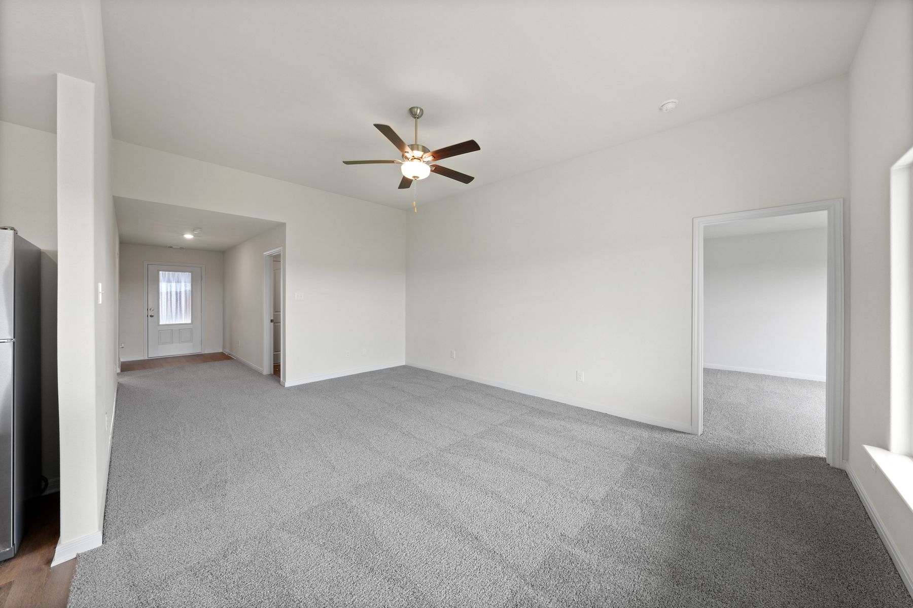 The spacious family room is perfect for family living and hosting.