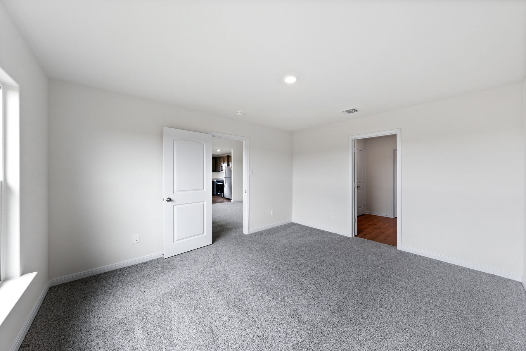 The master suite has a spacious bedroom, en-suite bathroom and walk-in closet.