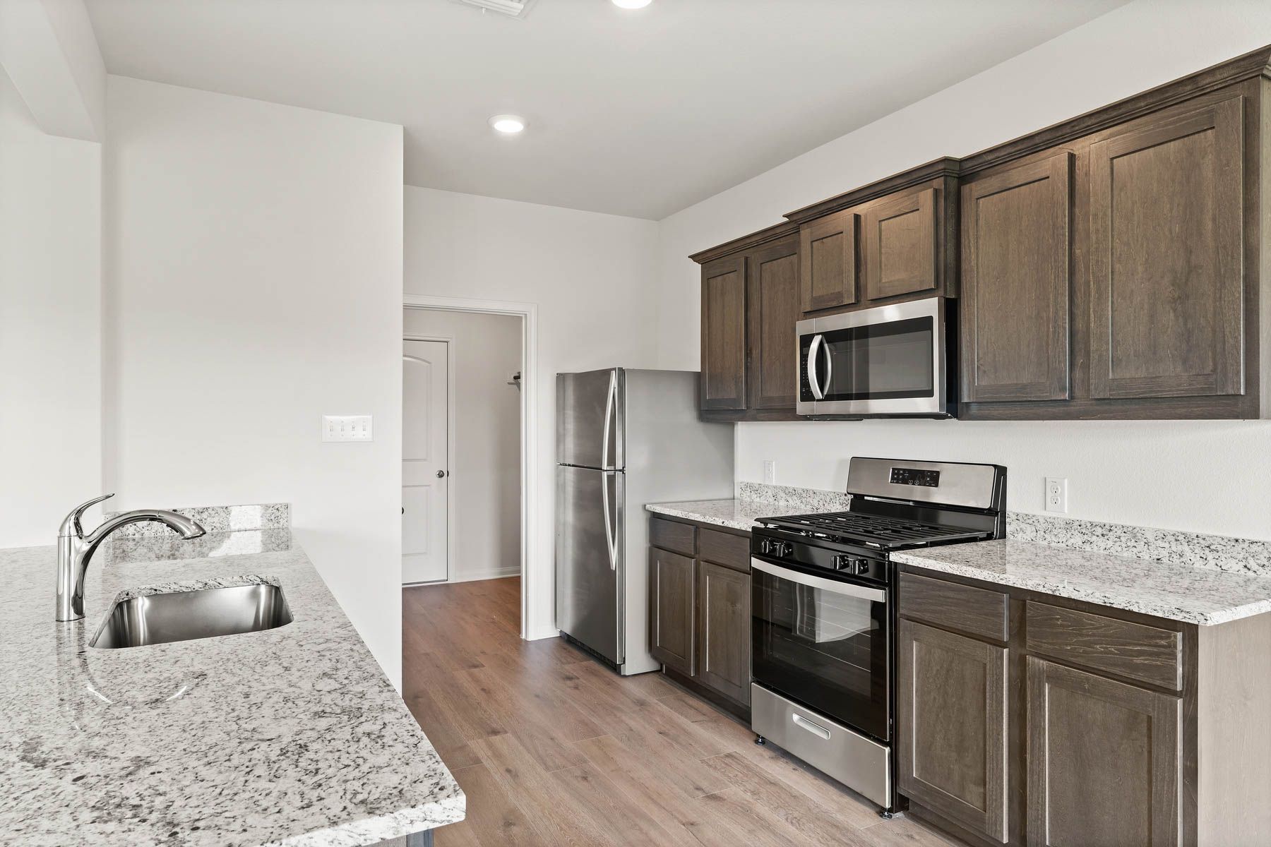 The kitchen has sprawling granite countertops.