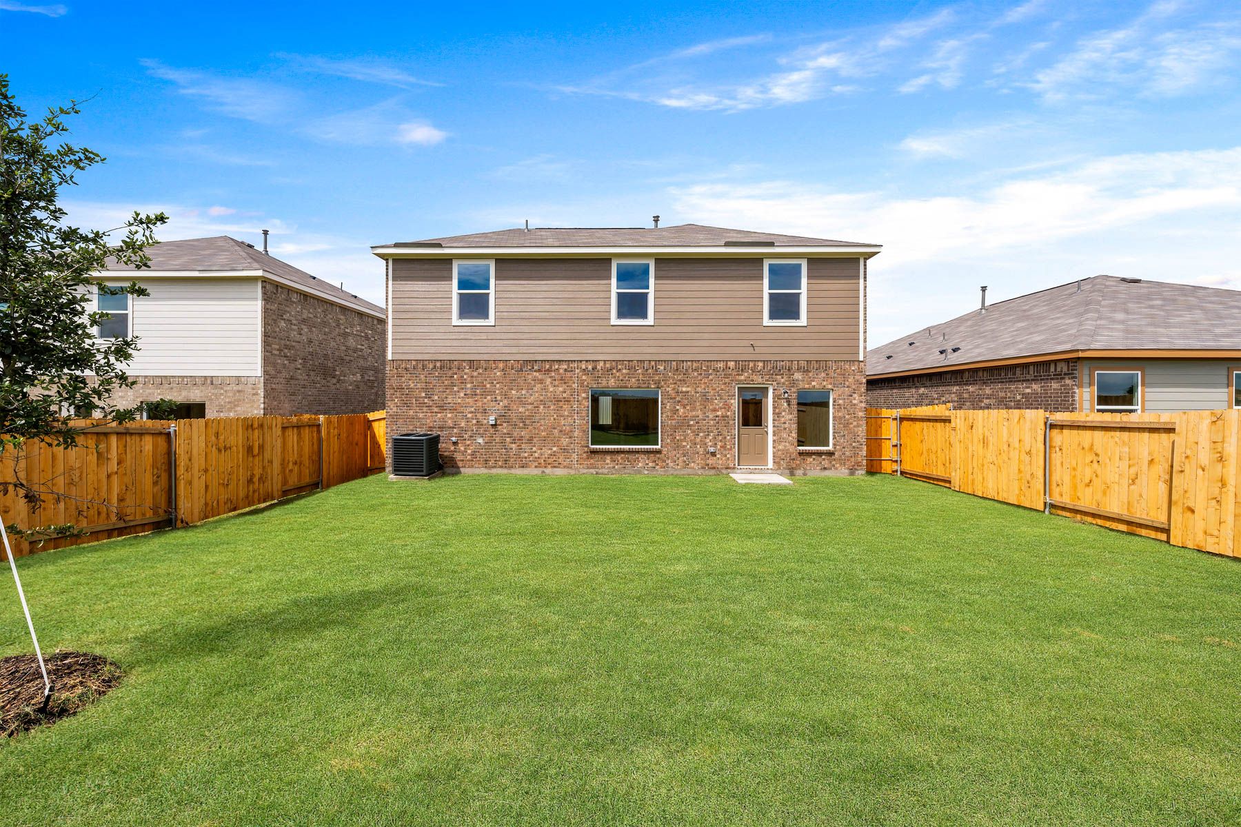 The back yard of the Cypress is large and fully fenced-in.
