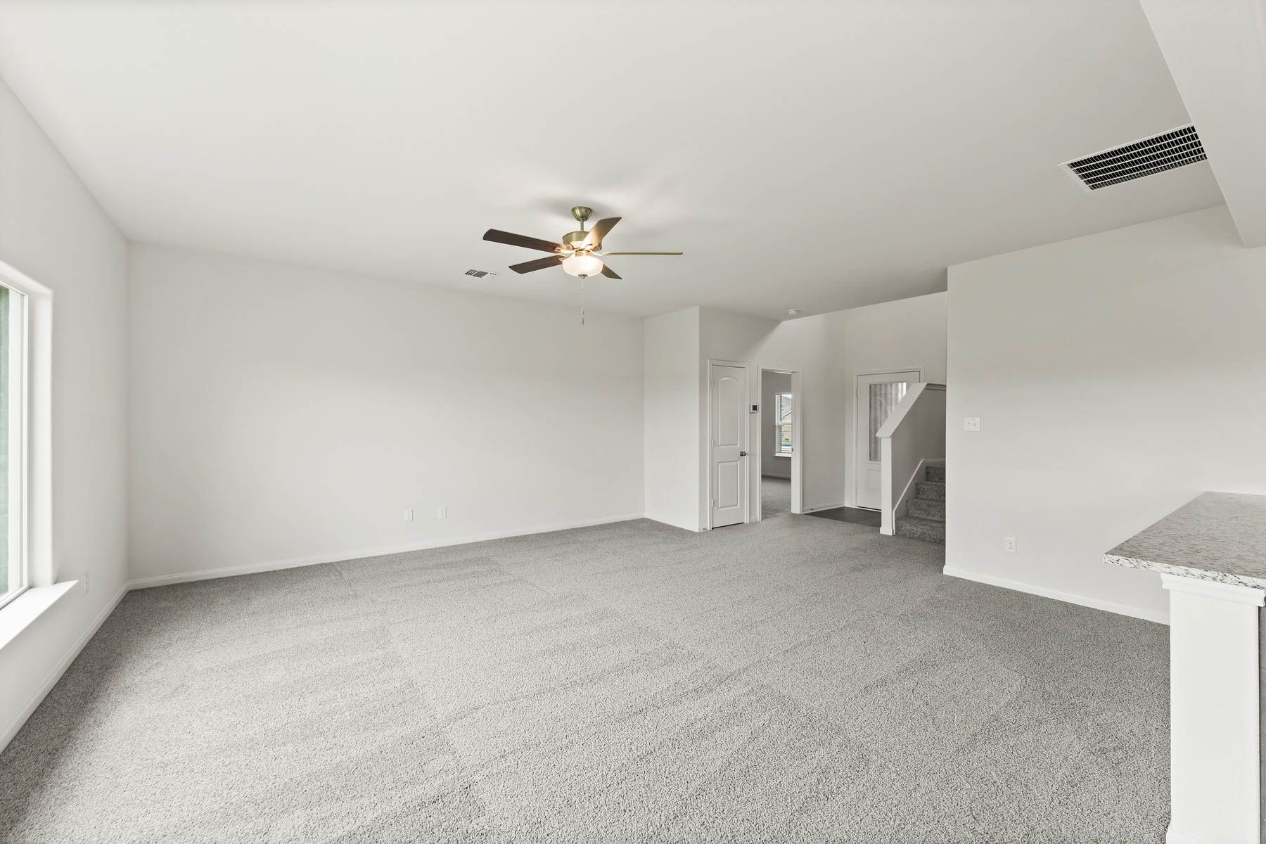 The spacious family room is perfect for everyday family living and hosting.