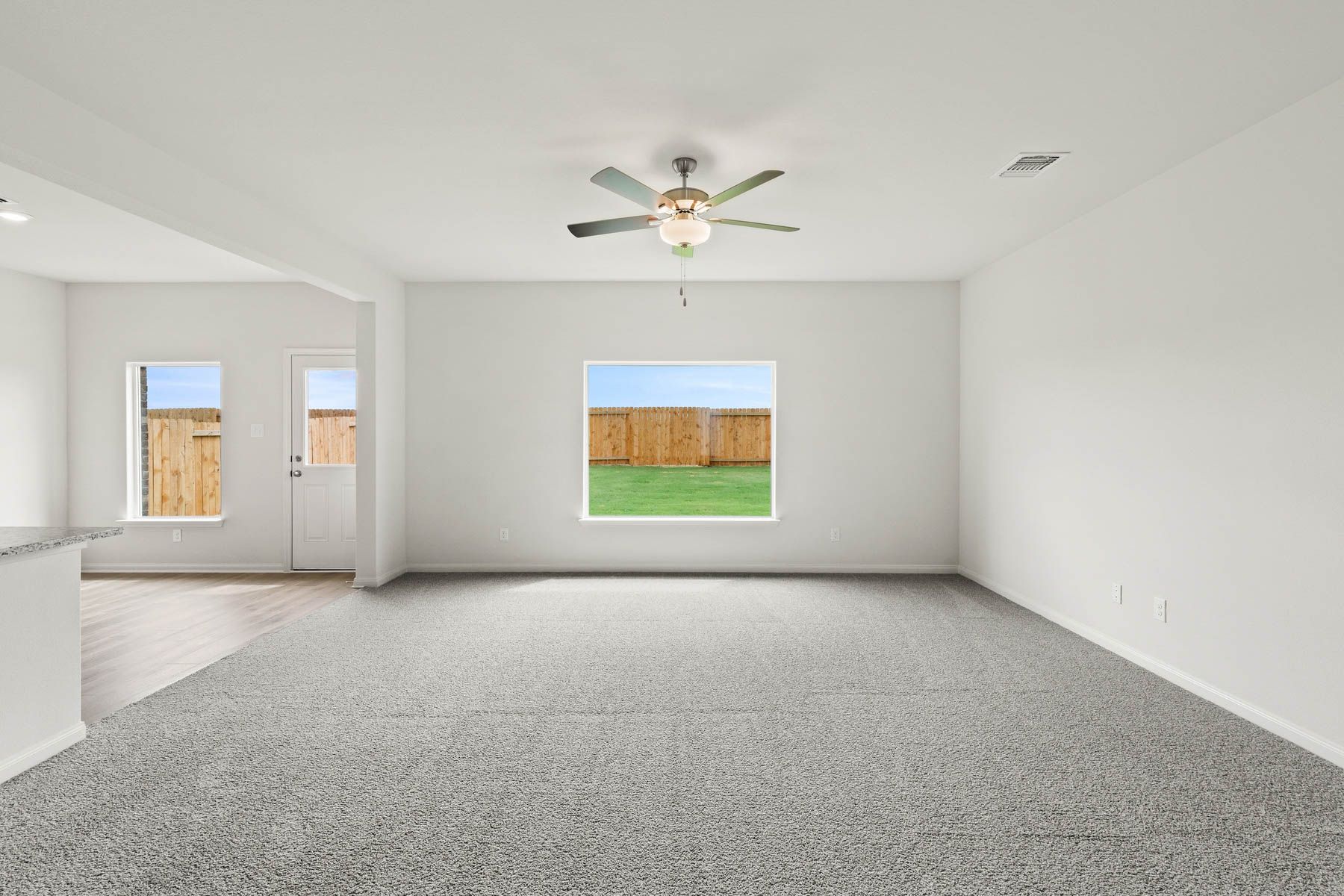 The family room has a large window that lets in great, natural lught and backyard views.