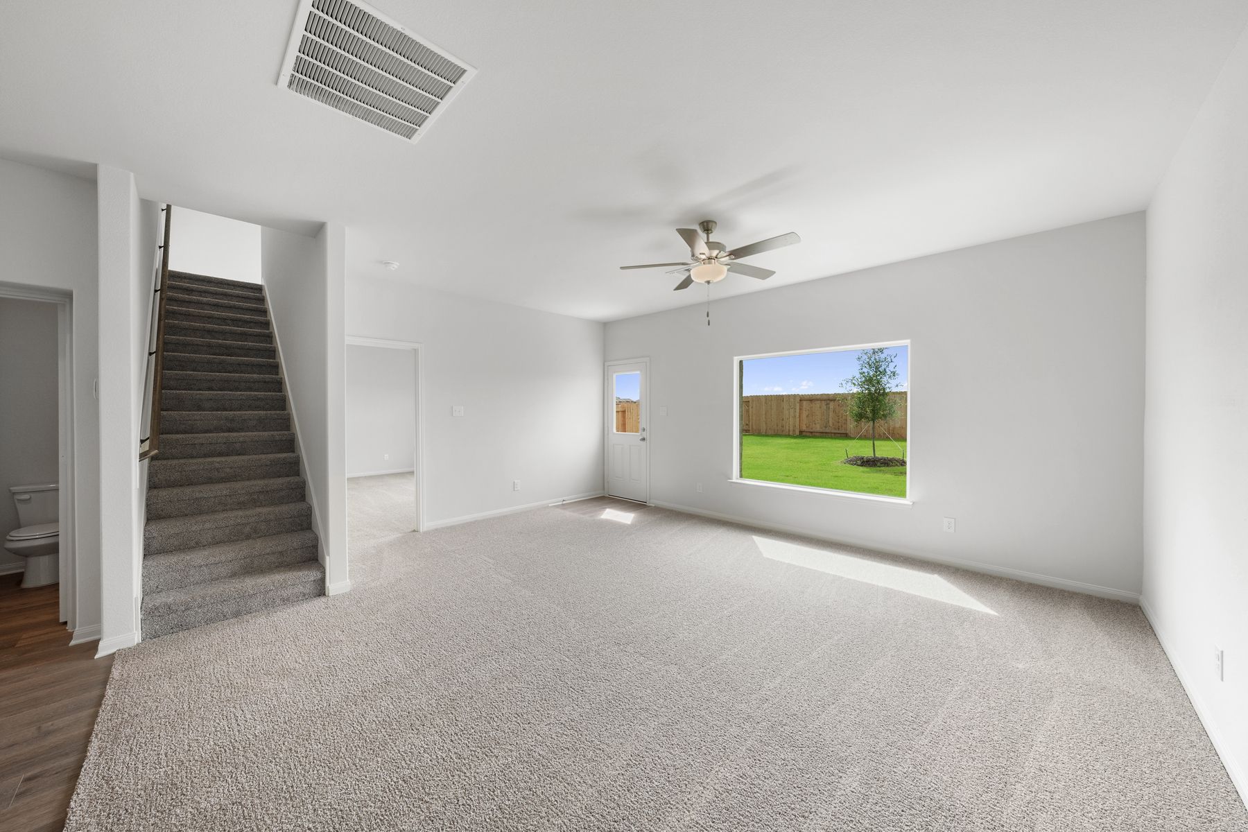 The open layout connects the kitchen with the dining room and family room.